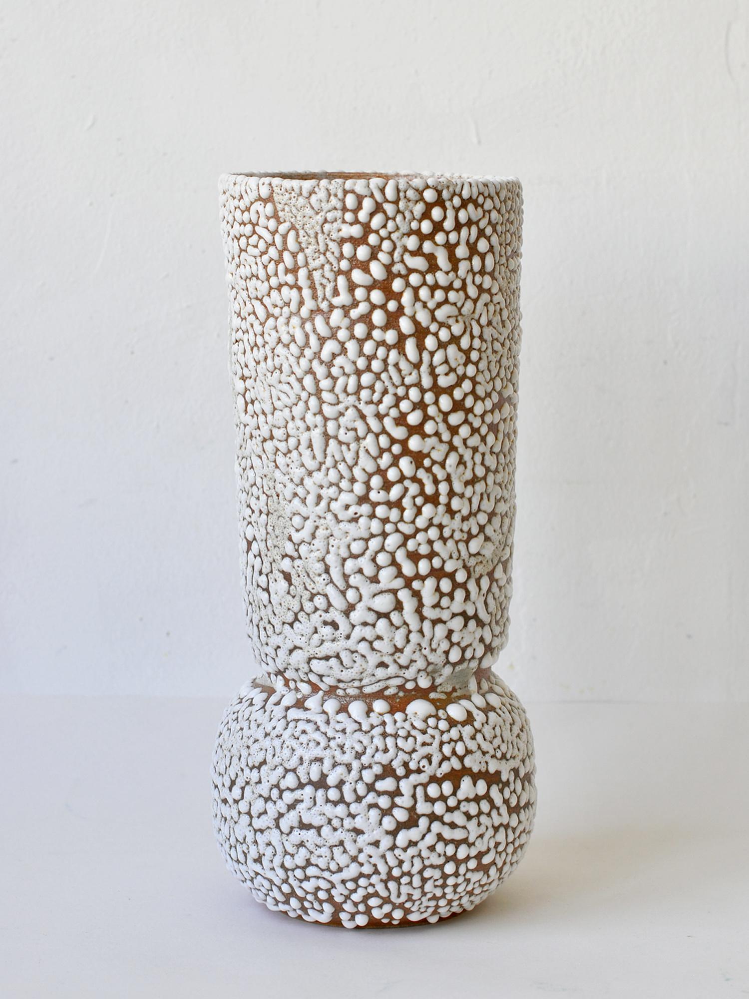 C-015 White Stoneware Vase by Moïo Studio
Dimensions: D14 x W14 x H30 cm
Materials: White crawl glaze on tan stoneware
Made by hand on the wheel
Unique piece, consult for multiples

Is the Berlin-based ceramic art studio of French-Palestinian