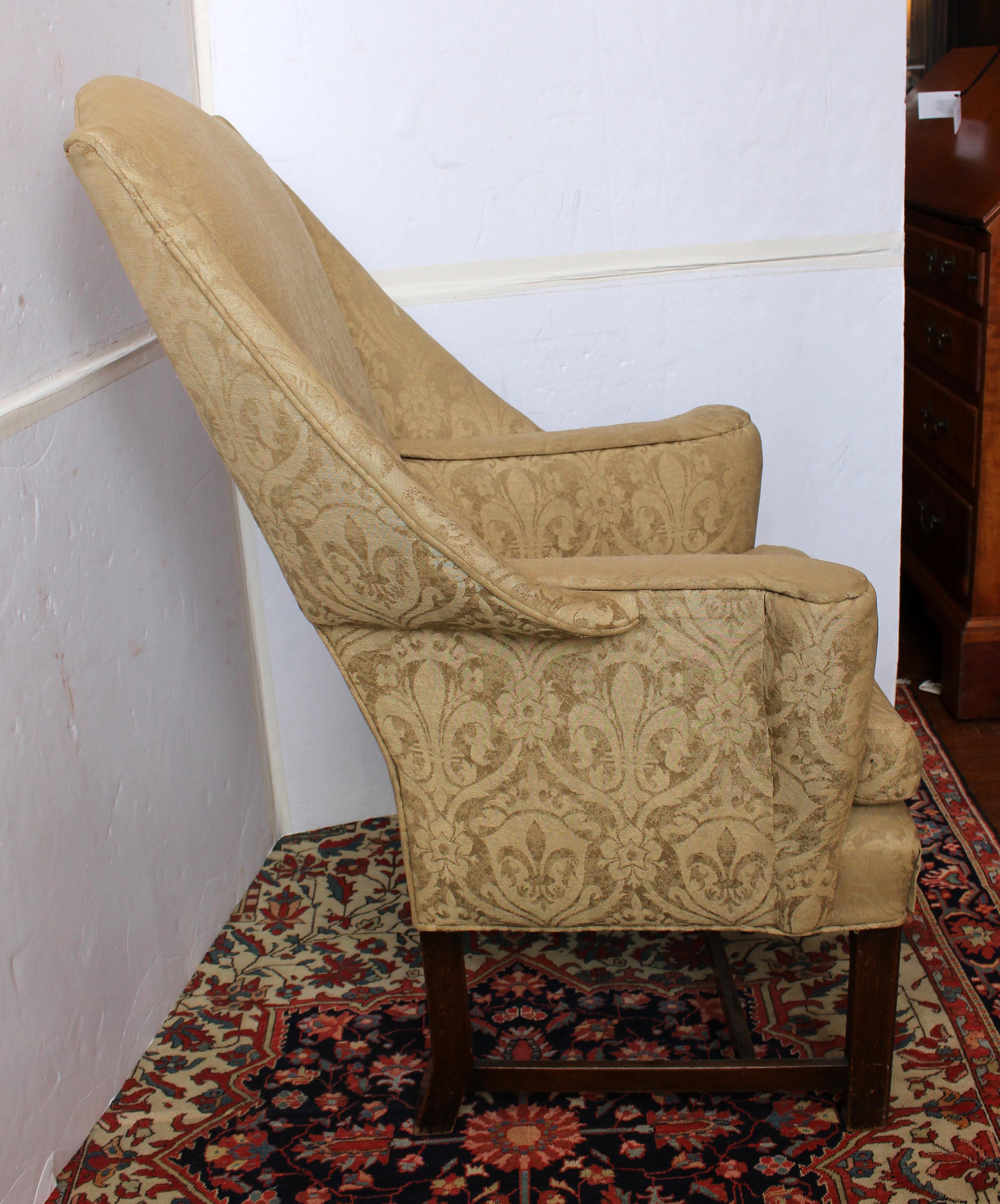 Circa 1780 Irish sleigh back wing chair. Raised on straight, square legs (the rear outswept). Shaped back descends gracefully to the wings and to the out-swept arms. In as found upholstery.
27