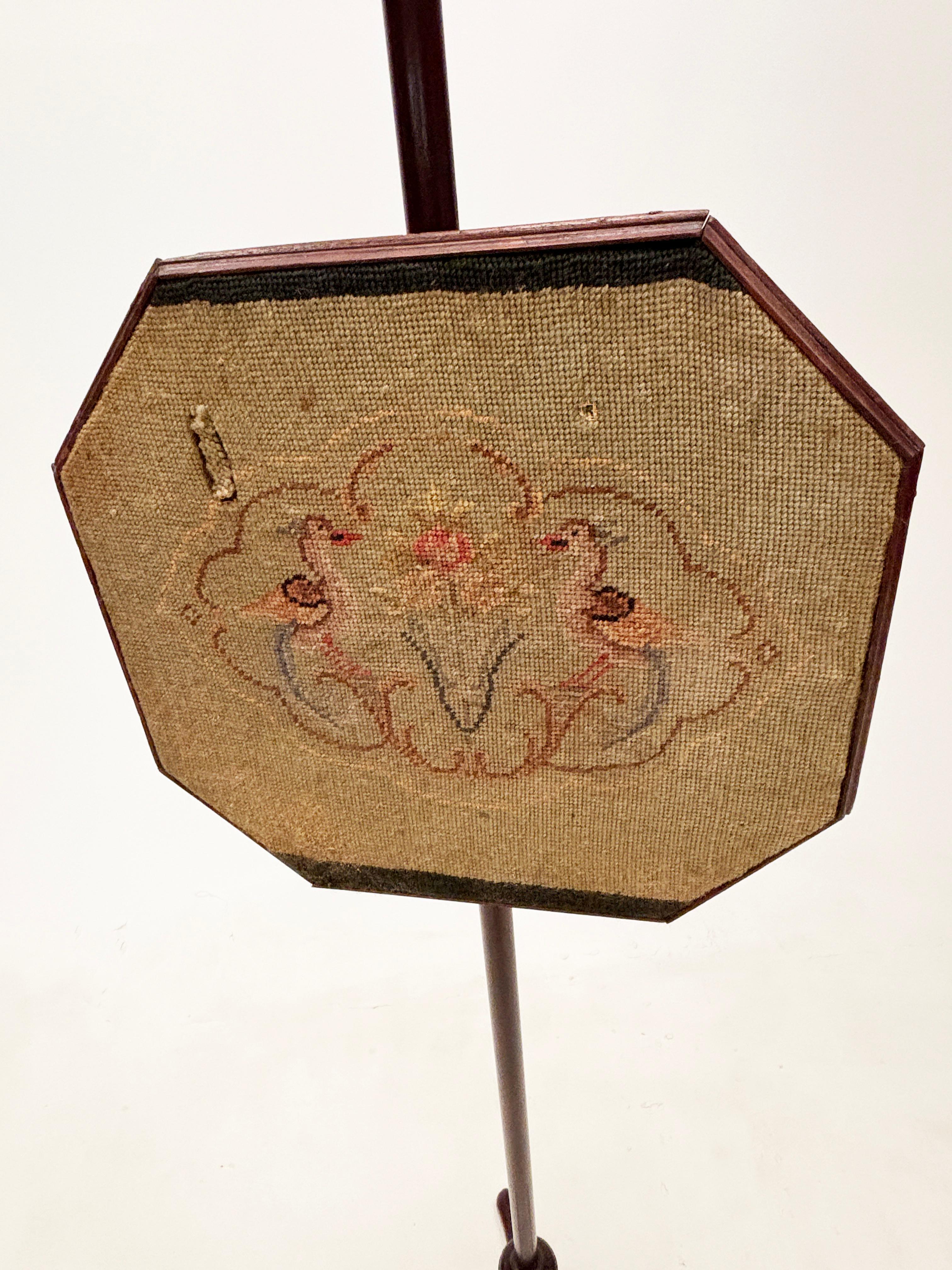 Unique and finely made, this English Regency pole screen is constructed of beautiful Rosewood that’s hand-turned, carved and jointed, topped with a delicate finial with three cabriole legs that finish in slipper feet. The gravity concept of the