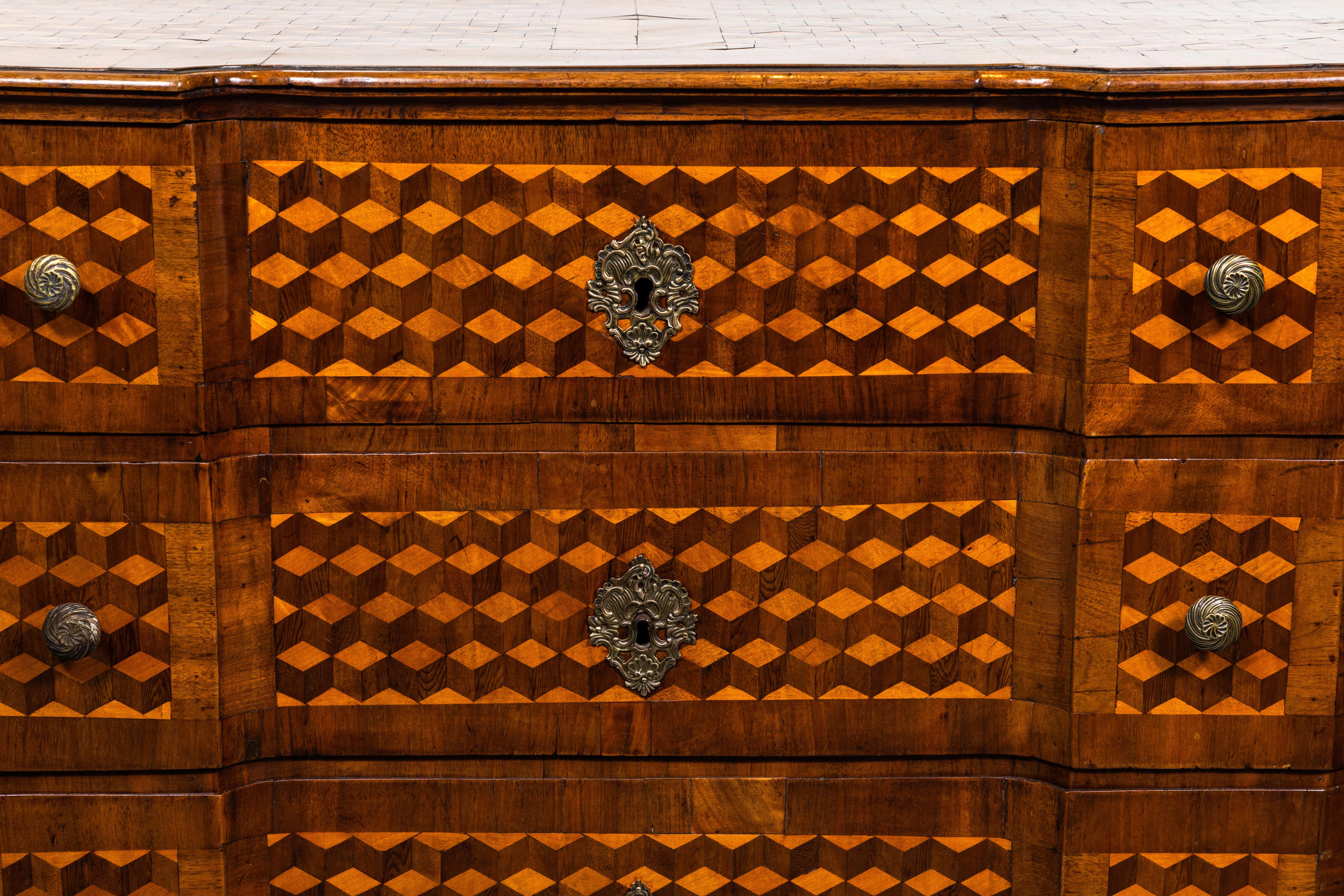 Chic, canted corner, three-drawer, walnut and pearwood commode from Modena, Italy. Striking parquetry surrounds the piece three quarters.