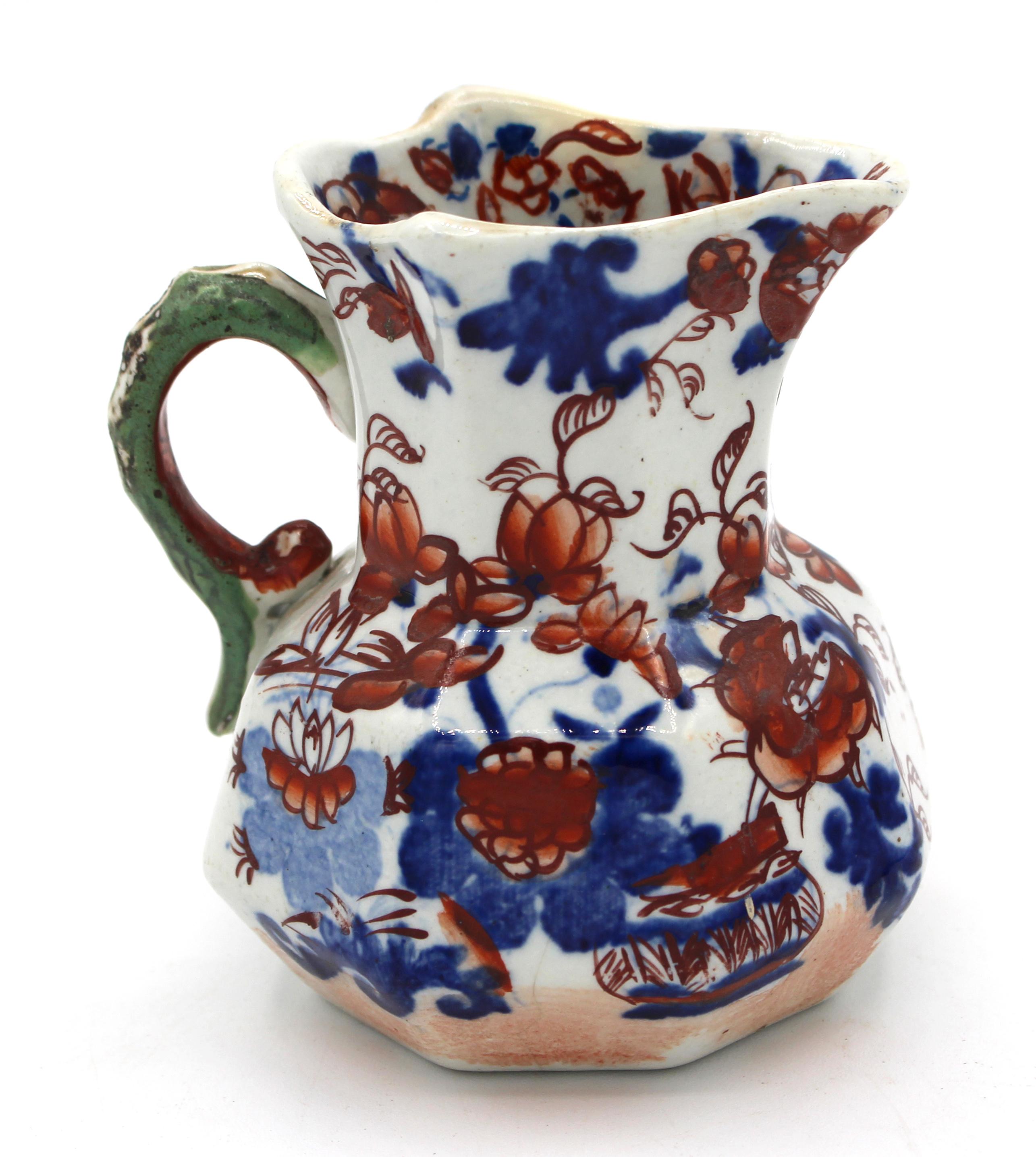 Circa 1815-30 Mason's Patent Ironstone China jug, English. Octagonal; hydra handle; Imari Japan Basket pattern. Blue printed, widely space mark.
3 5/8