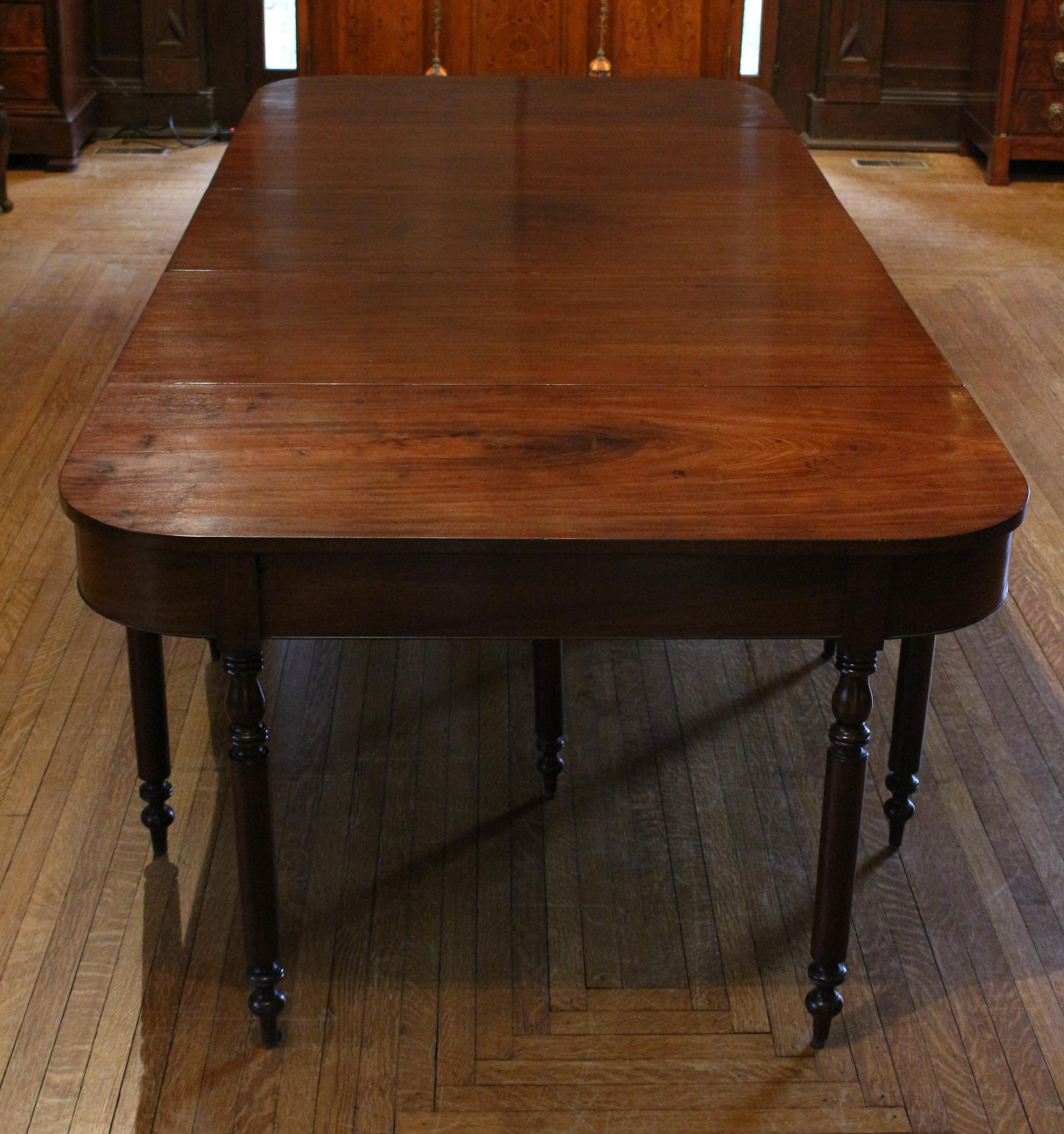 Circa 1830 North Carolina console end banquet table. Two d-ends with drop-side center section - can be used as two console tables and drop-side table or together as a banquet table (clips hold the ends to the center drop end section). Made of walnut