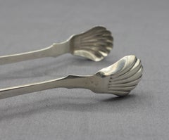 c. Pinze da zucchero in argento con moneta del 1830