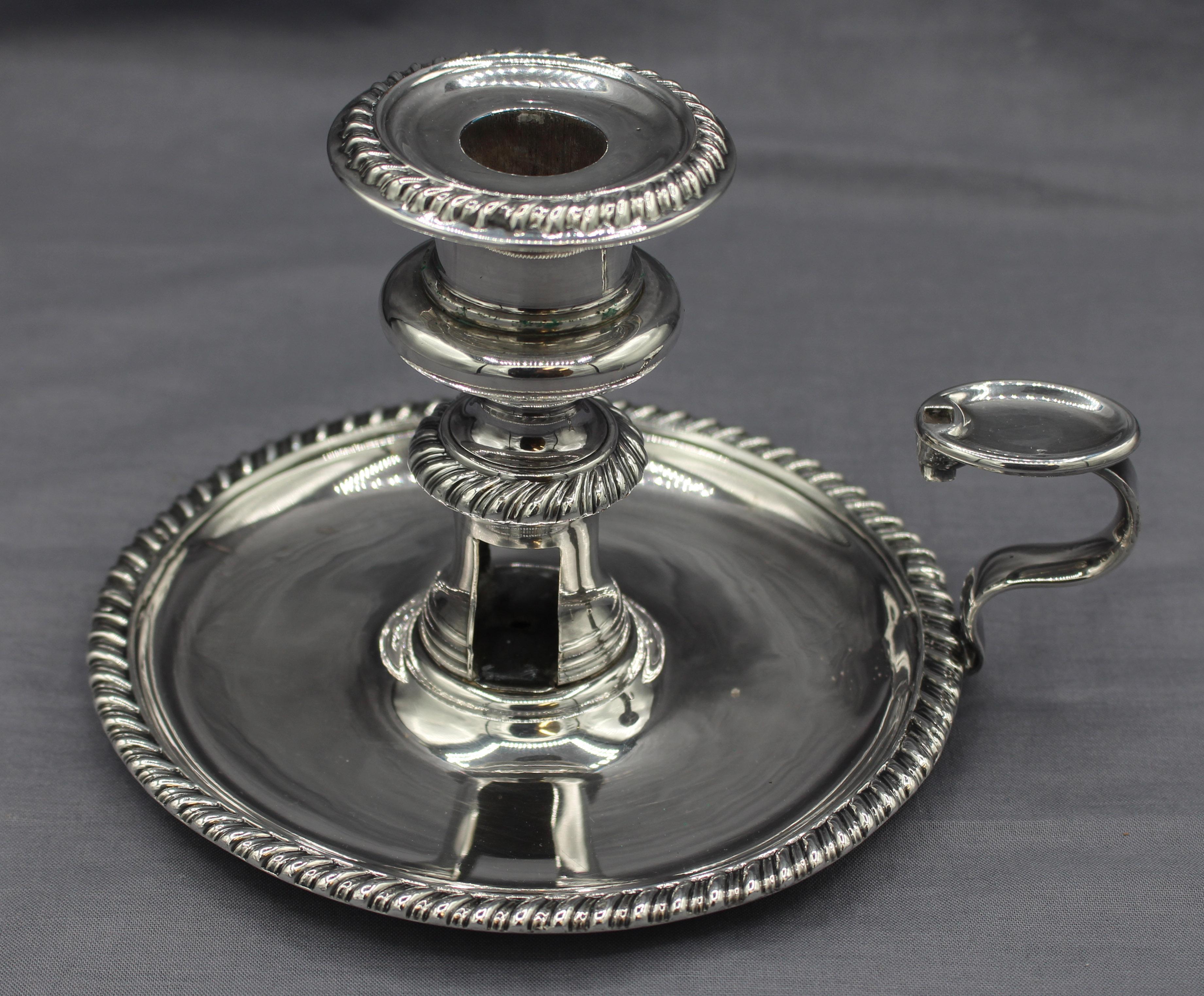 Circa 1830s Old Sheffield Plate chamber stick, English. Original snuffer. Lacks wick trimmer.
5 7/8