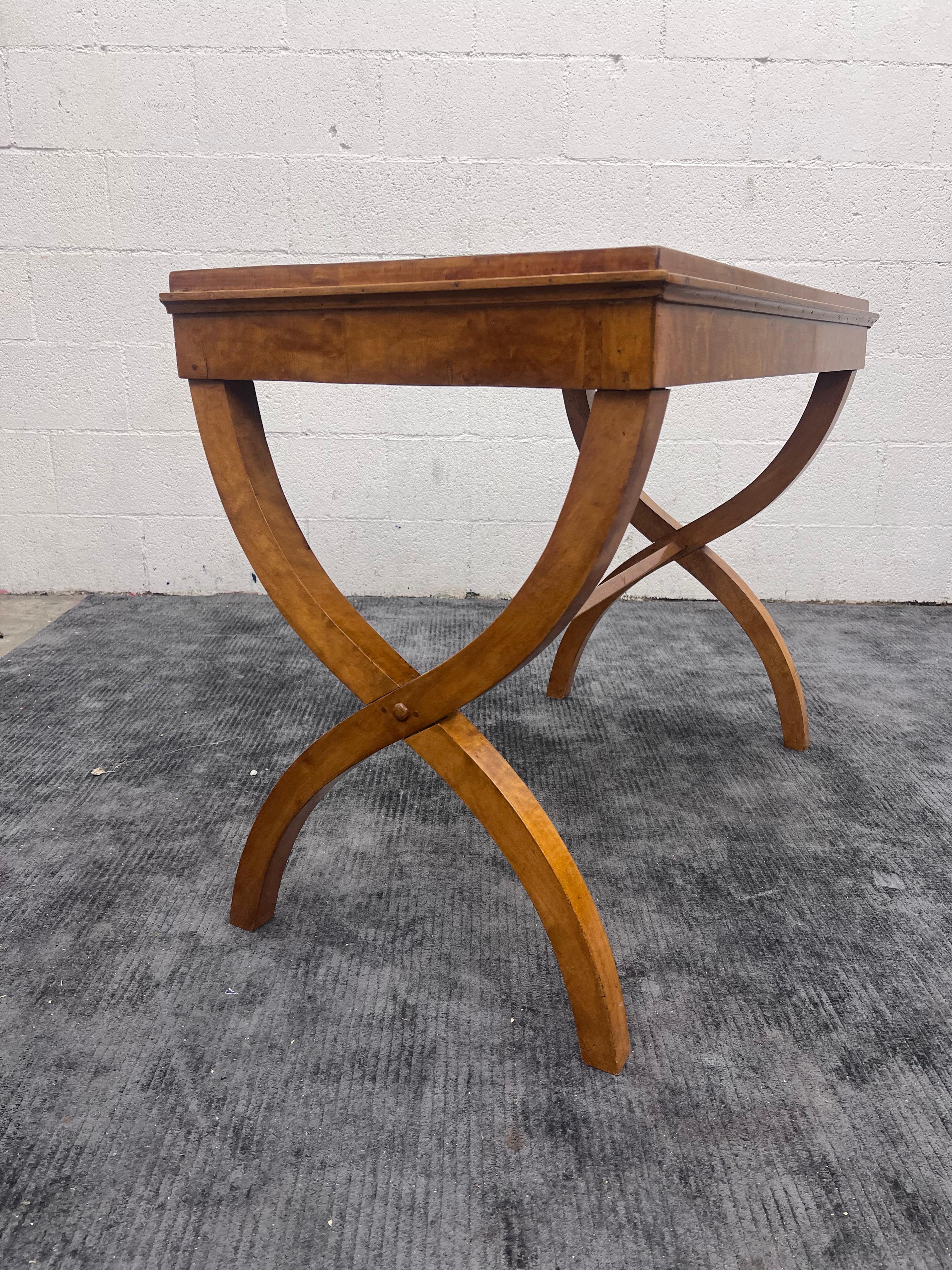 Finely crafted Condole, sofa, or entryway way table from the 1840-1860s. 
Book matched highly figured wood grain. 
X-shaped legs. 

Biedermeier designers embraced a more natural, relaxed look. Common features of the style are curves, playful