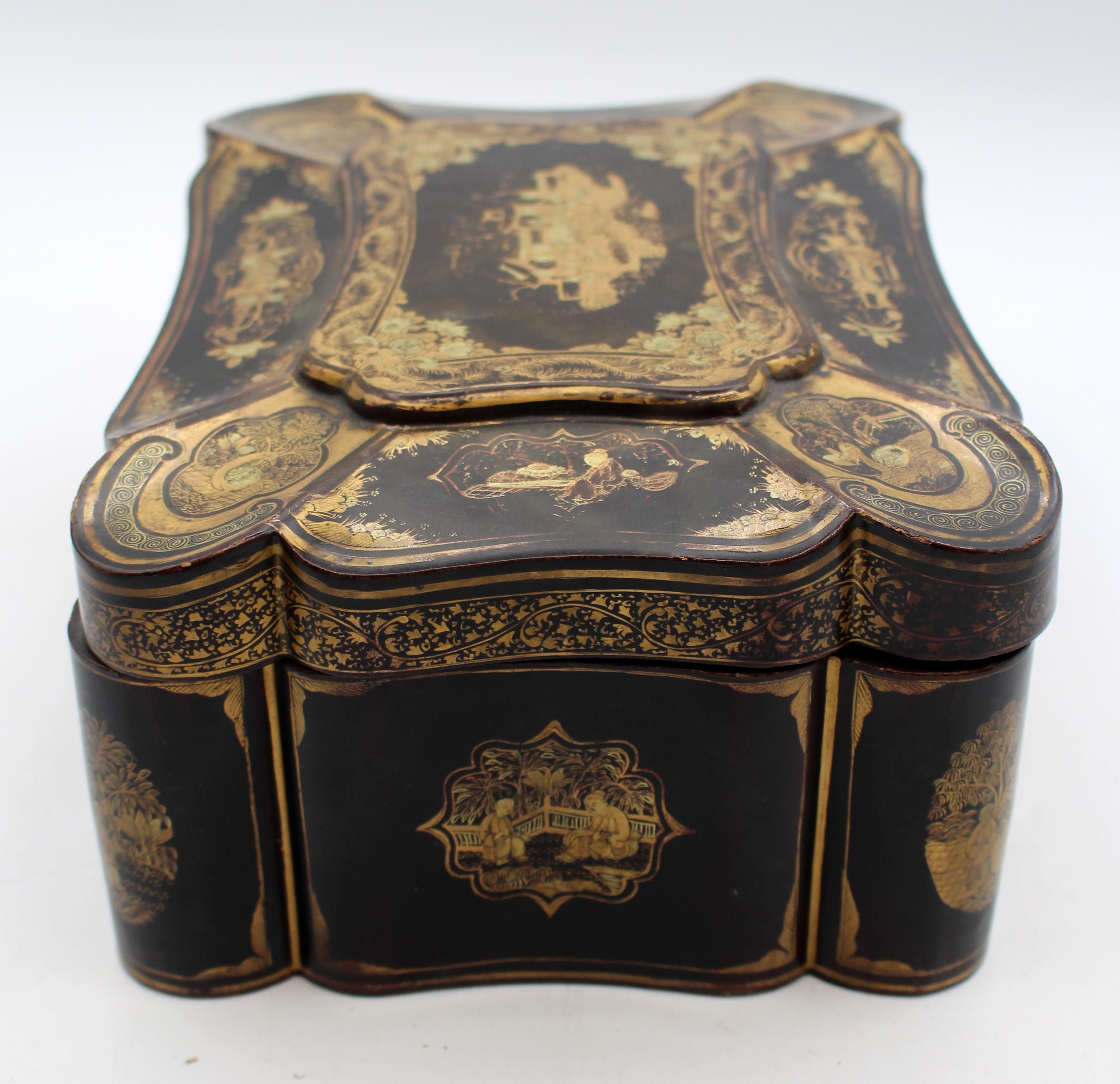 Circa 1840-60 Chinese lacquer on wood work or letter box. Cartouche shaped. The entire exterior is decorated with each curved & shaped panel decorated with a gilt scene within a cartouche shaped reserve. Replaced hinges. No lock plate.
8.75