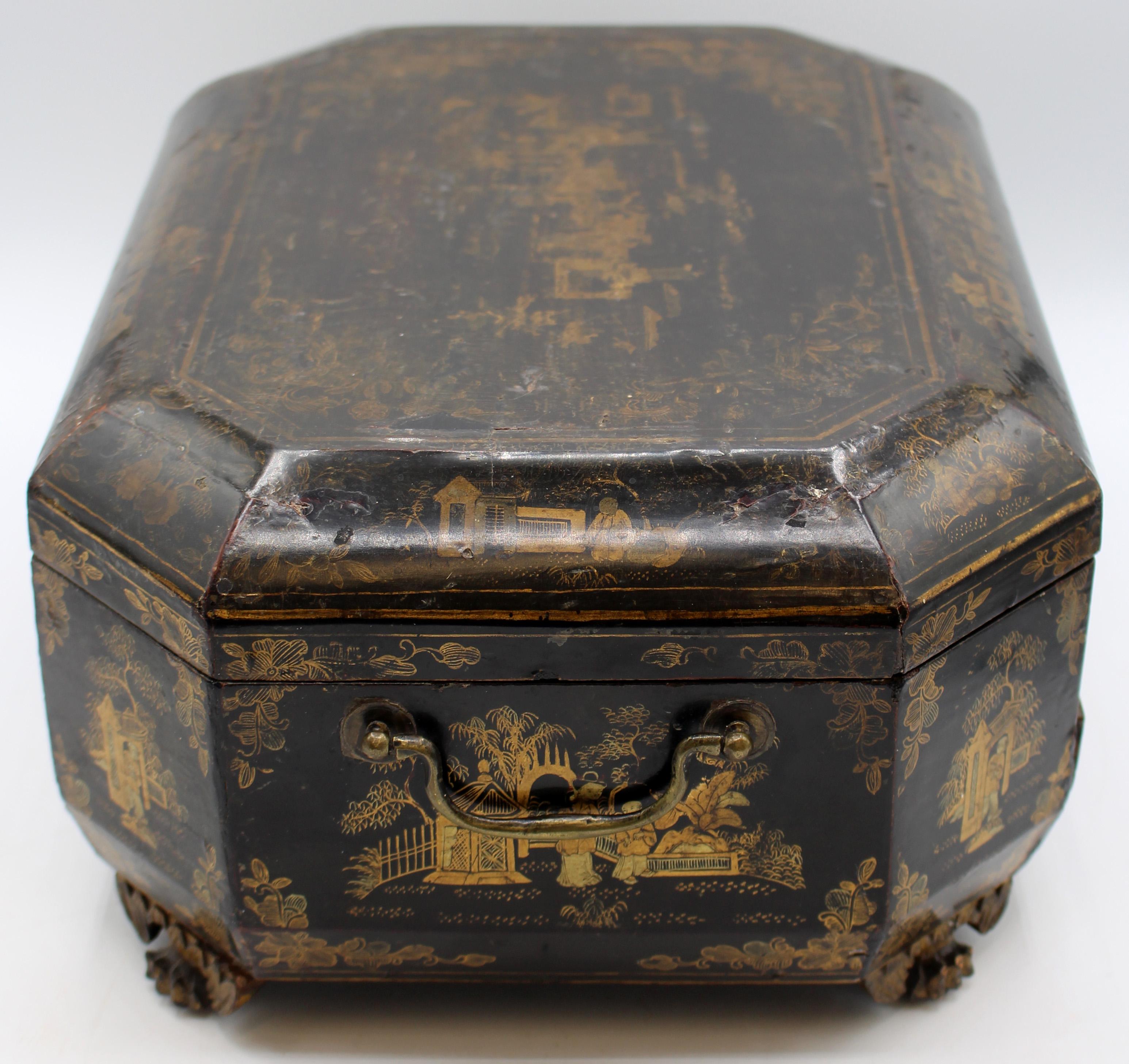 Circa 1840-60 Chinese Export sewing box. Gilt & lacquer decorated with writing/reading surface in bottom drawer. Carved, winged feet. Original side brass handles. Worn top surface & only partially fitted.
14.5