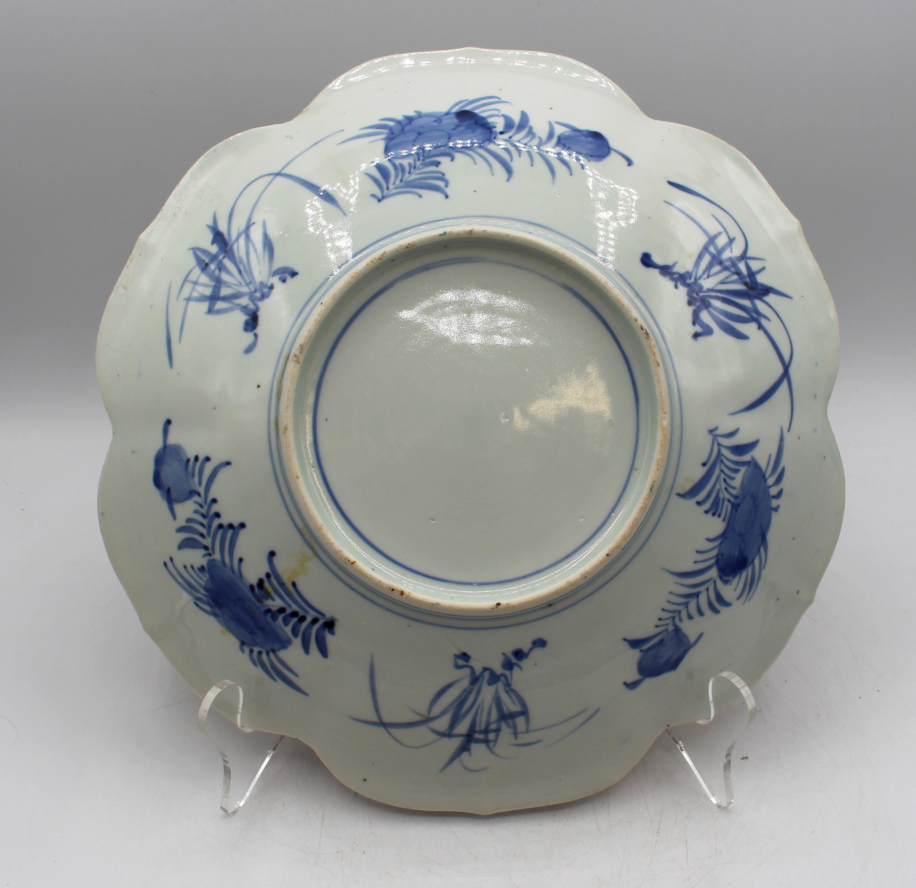 Circa 1860 lobed Imari chop plate, Japanese. The lobes elegantly pointed; 4 large reserves featuring Phoenix birds, symbols of long life & immortality. Diapered borders. Central blue & white naturalist medallion. Well decorated en verso.
11 5/8