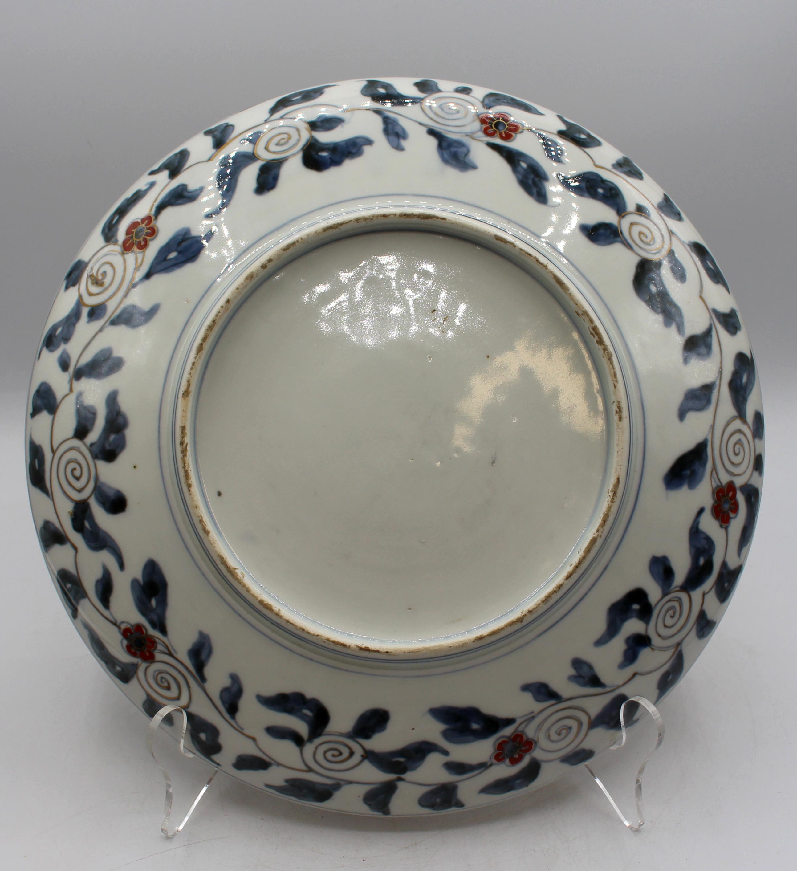 Circa 1860s Imari gilt Phoenix birds Chop Plate, Japanese. Exceptionally elegant featuring magnificent gilded phoenix birds with demilune reserves of Kylins. Burnt orange & gilt Greek key border.
12 3/8