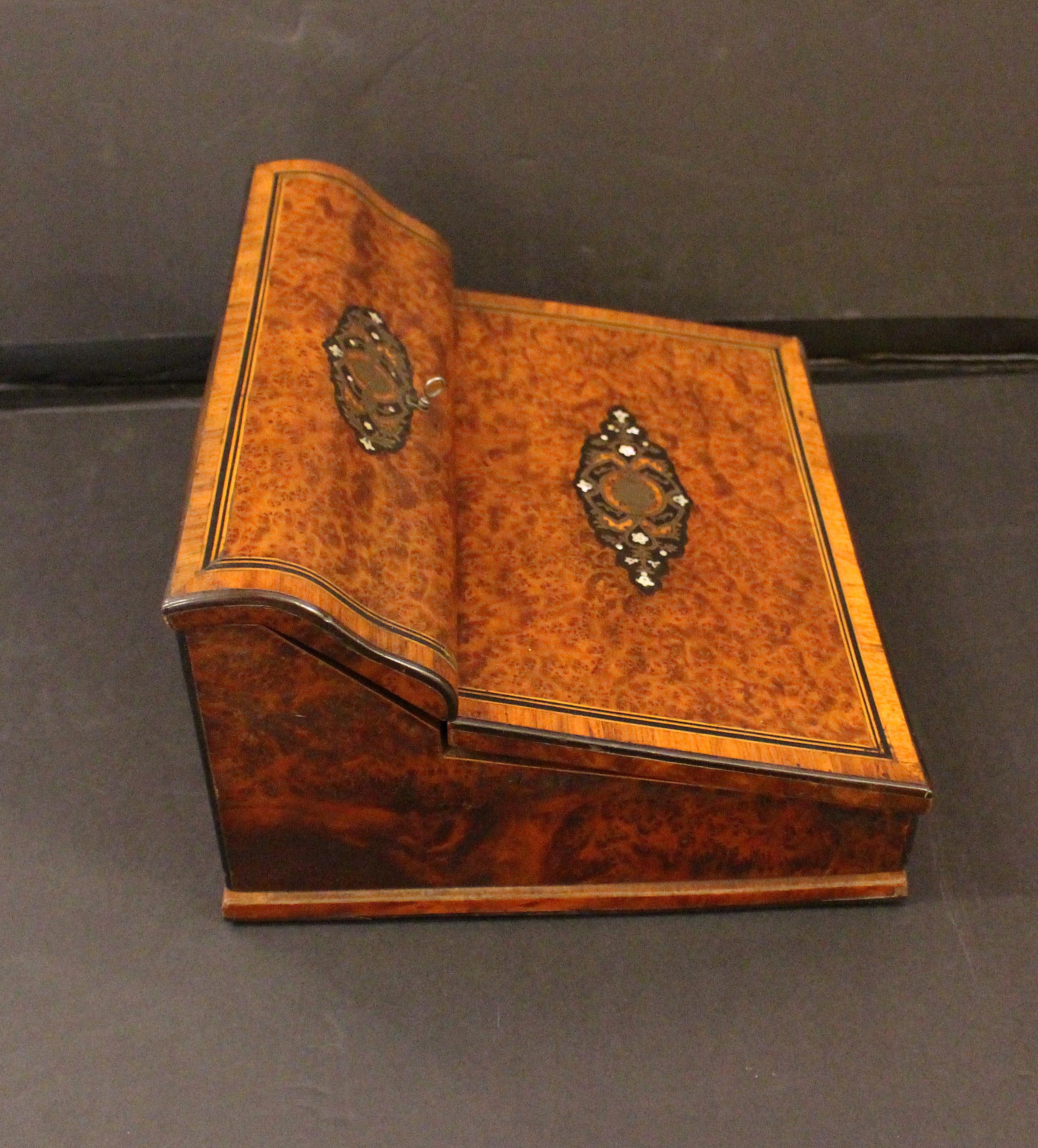 French, circa 1865, Napoleon III table top writing desk box. Burl amboyna, ebony & boulle inlays. Opens to undulating divided stationary compartment & writing surface of blue cut velvet (as found) and large well & pen tray. Brass hardware with