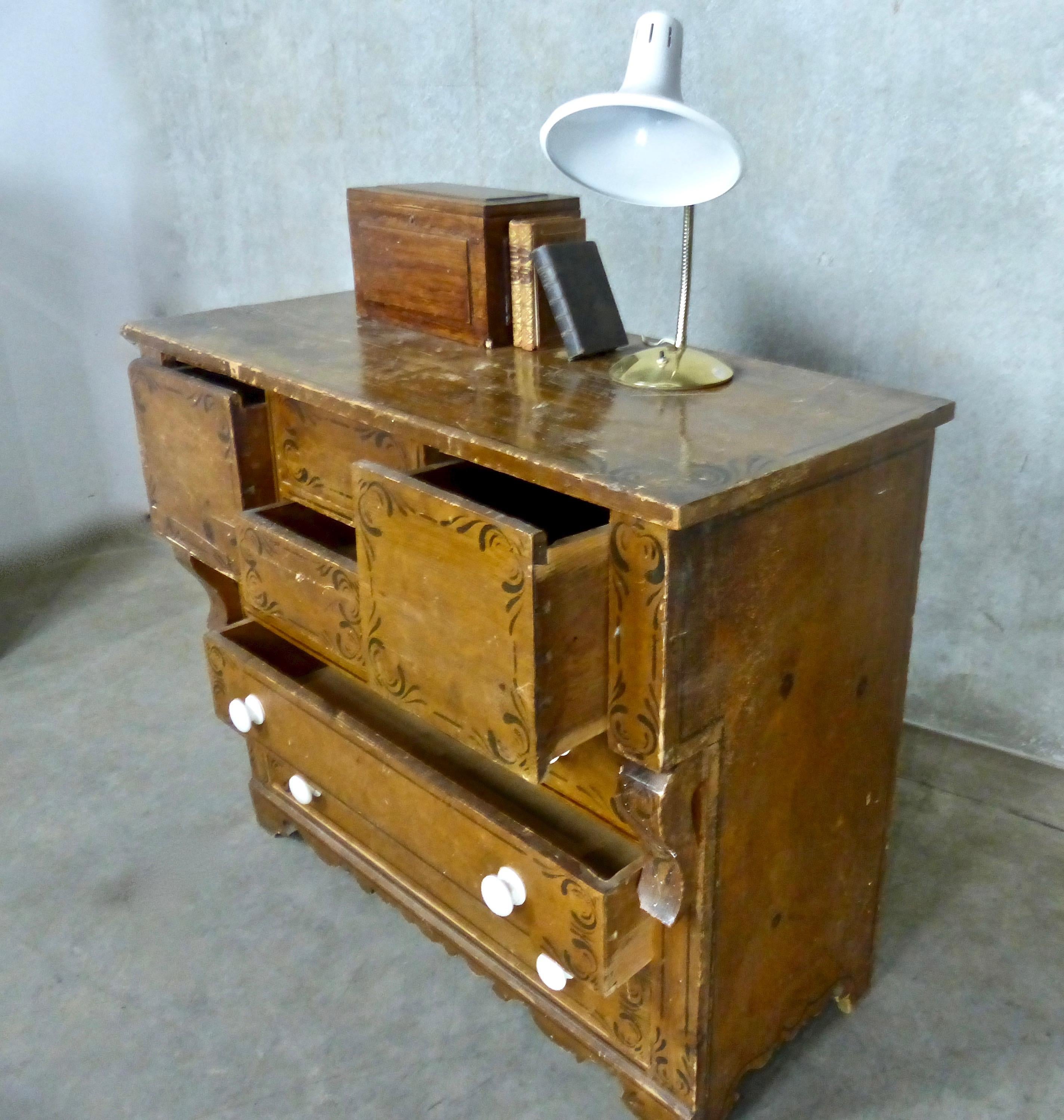 Original, Folk Art-style stencilling on a circa 1870 pine chest of drawers. 
Multiple drawers in a variety of sizes.
Genuine piece of Canadiana, found in Newfoundland.
Dimensions: 37