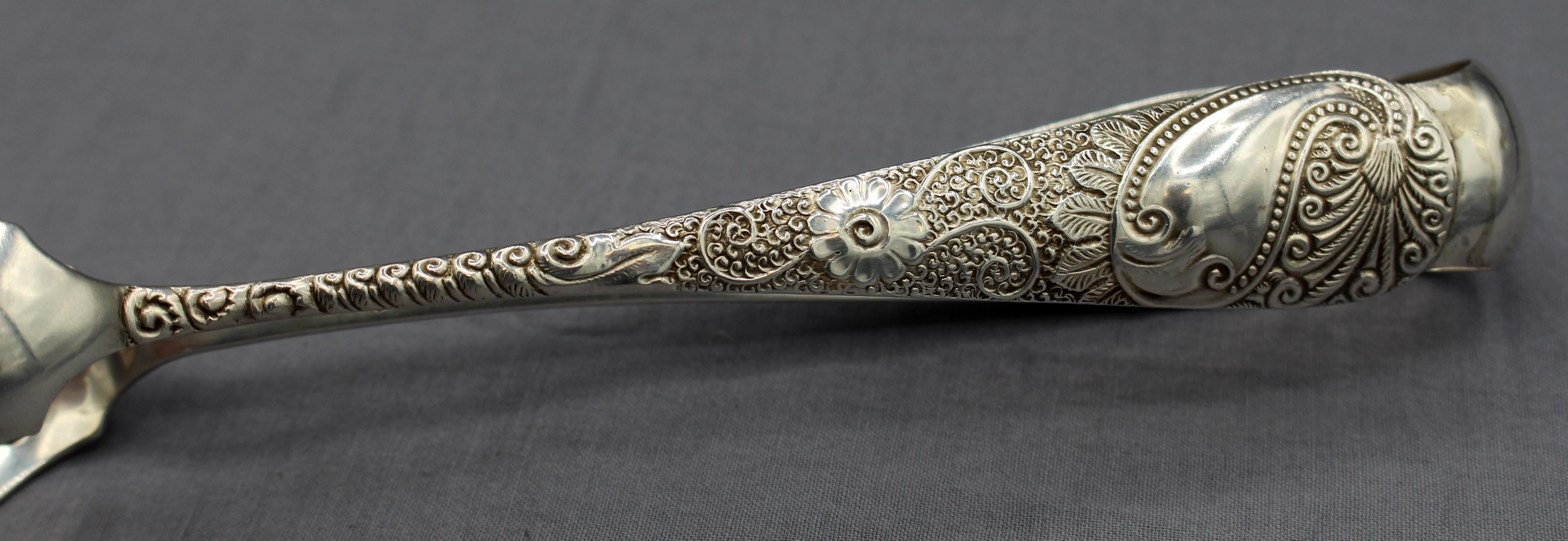 Sterling silver ice tongs made in Baltimore, c.1870-80s. By John C.C. Justice & James R. Armiger. Superb Aesthetic Movement design. Old, fine repair. 1877-1892 marks. 3 troy oz.
7.75