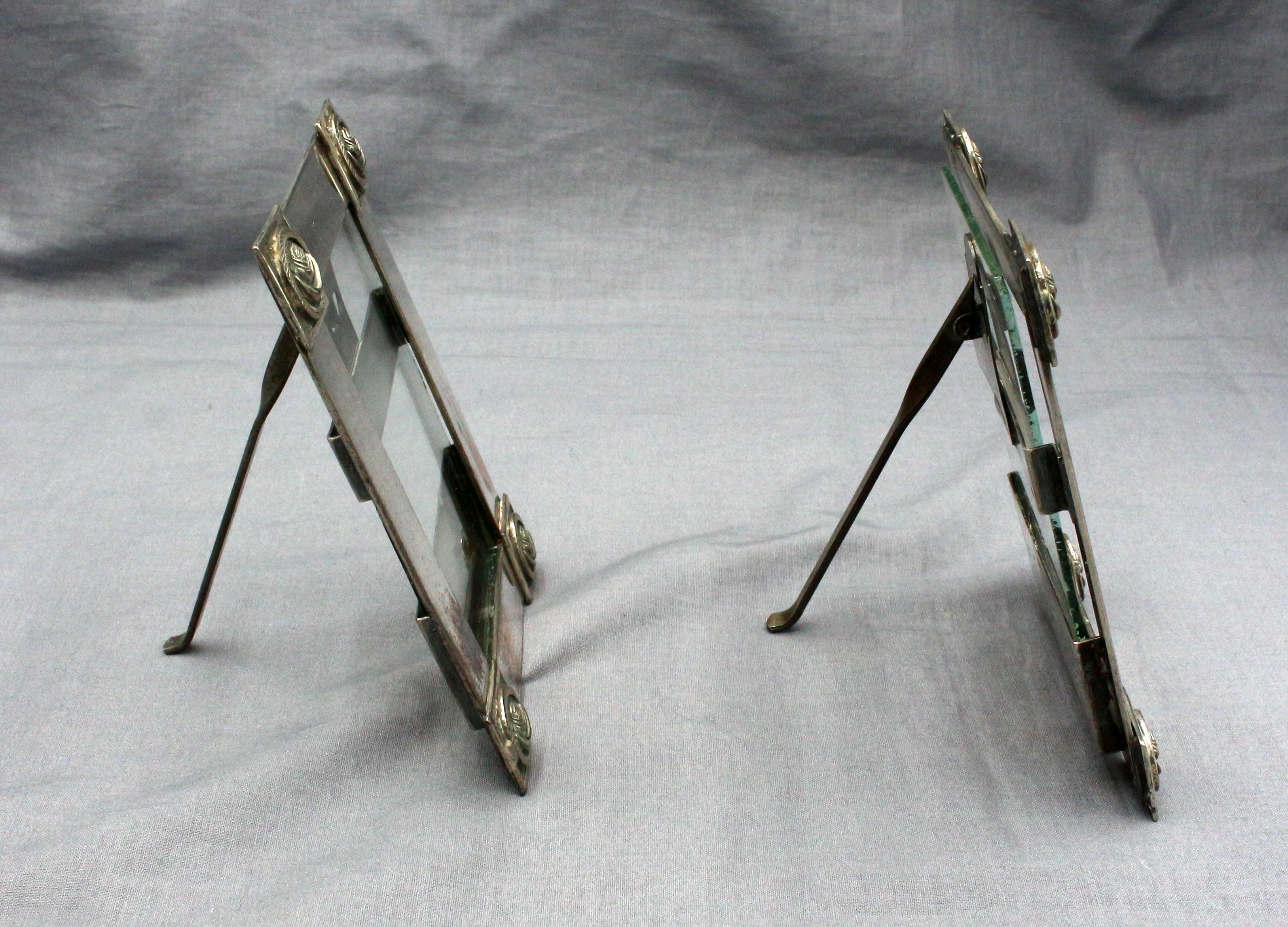 Pair of silver & silver on copper small picture frames with easel stands, Finnish, c.1880-1920. Arts & Crafts, hand made. The corner bosses are cast solid silver. Pivot pins replaced.
5