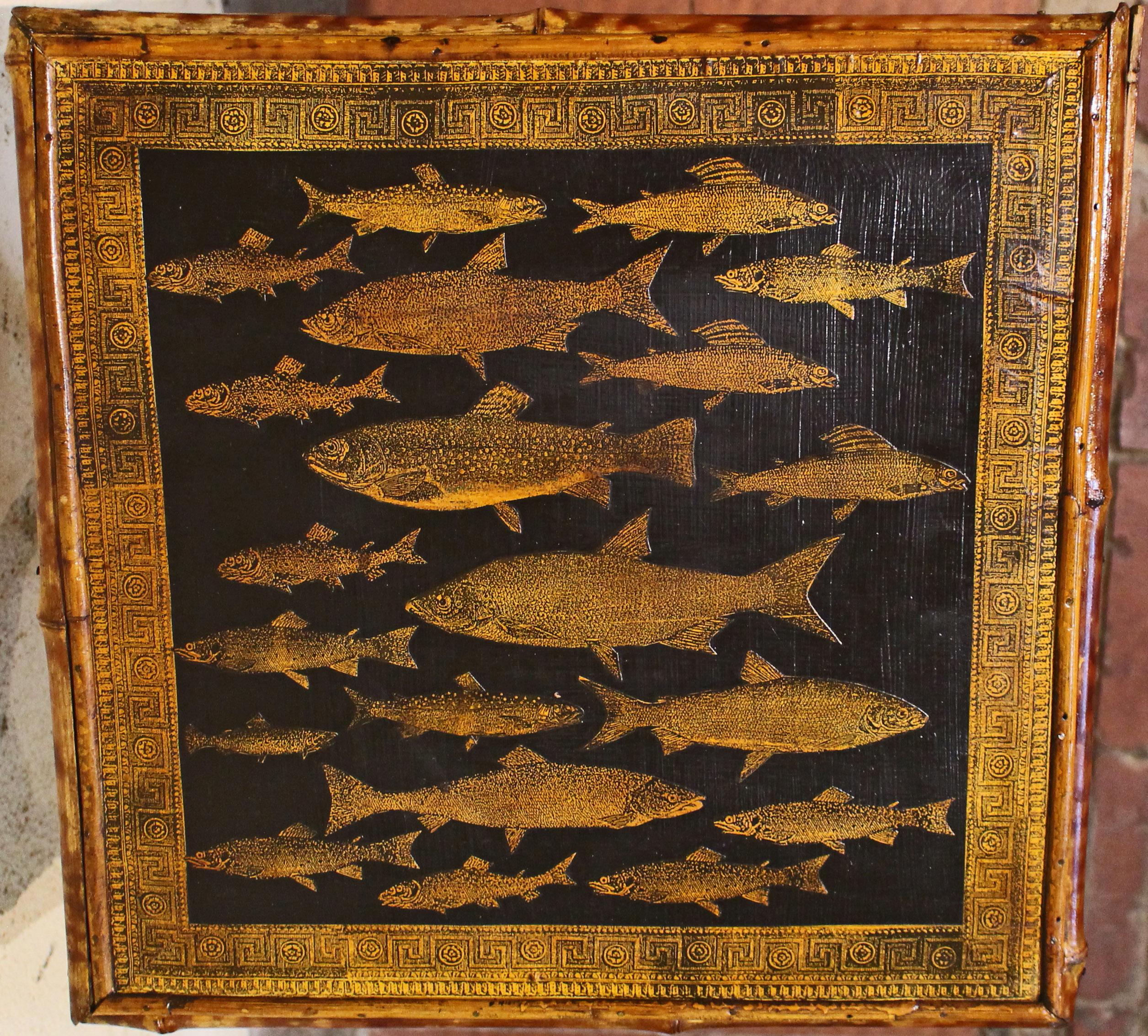 Circa 1880 square 2-tier bamboo table, English. The surfaces now artisan decoupaged with fish. Well figured 
