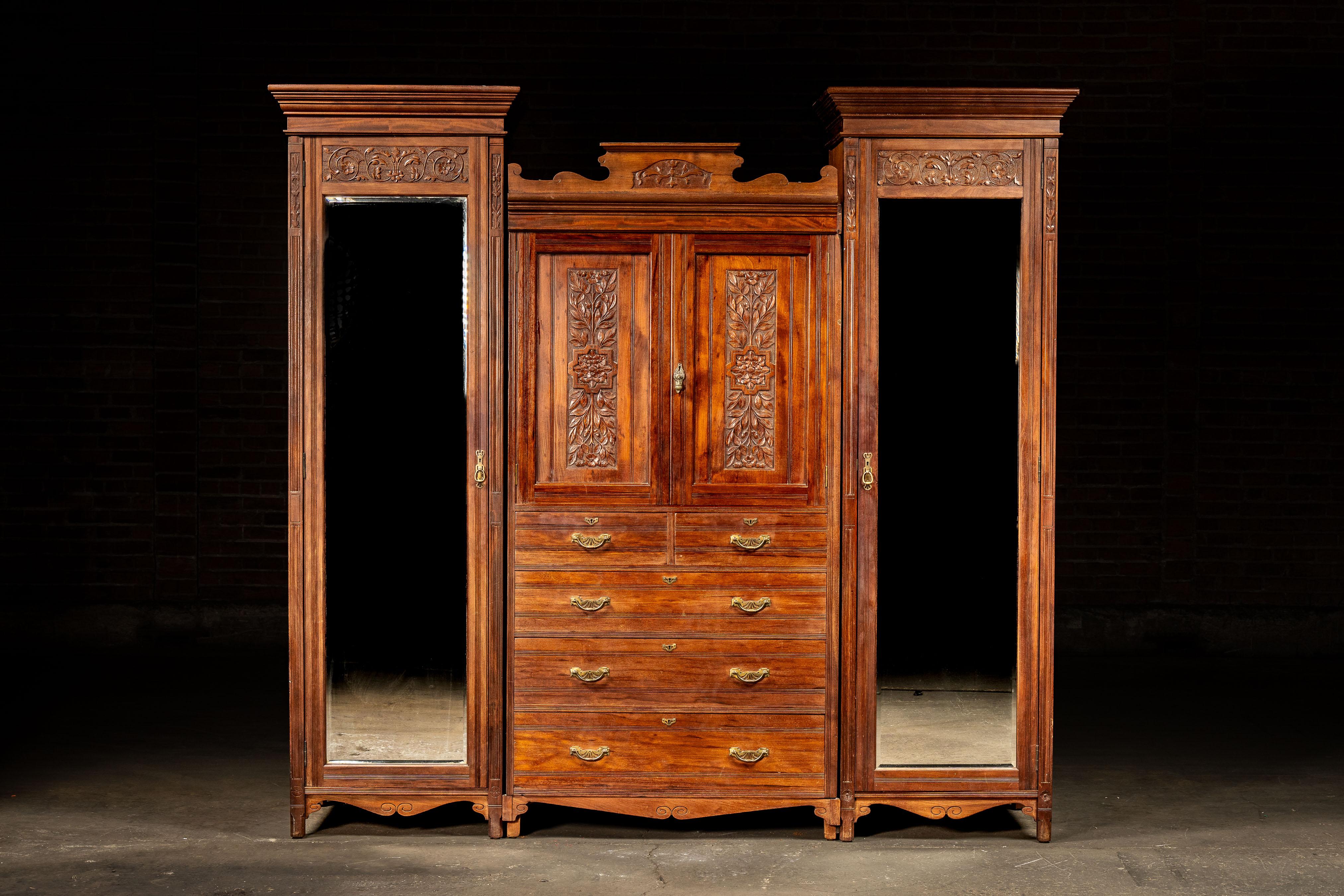 c. 1880s/1890s; Edwards & Sons - Newcastle, Tyne and Wear, England

This antique cabinet brings together three of the major artistic movements from its period: Arts and Crafts, Craftsman, and Art Nouveau. It comes in three sections that can each be