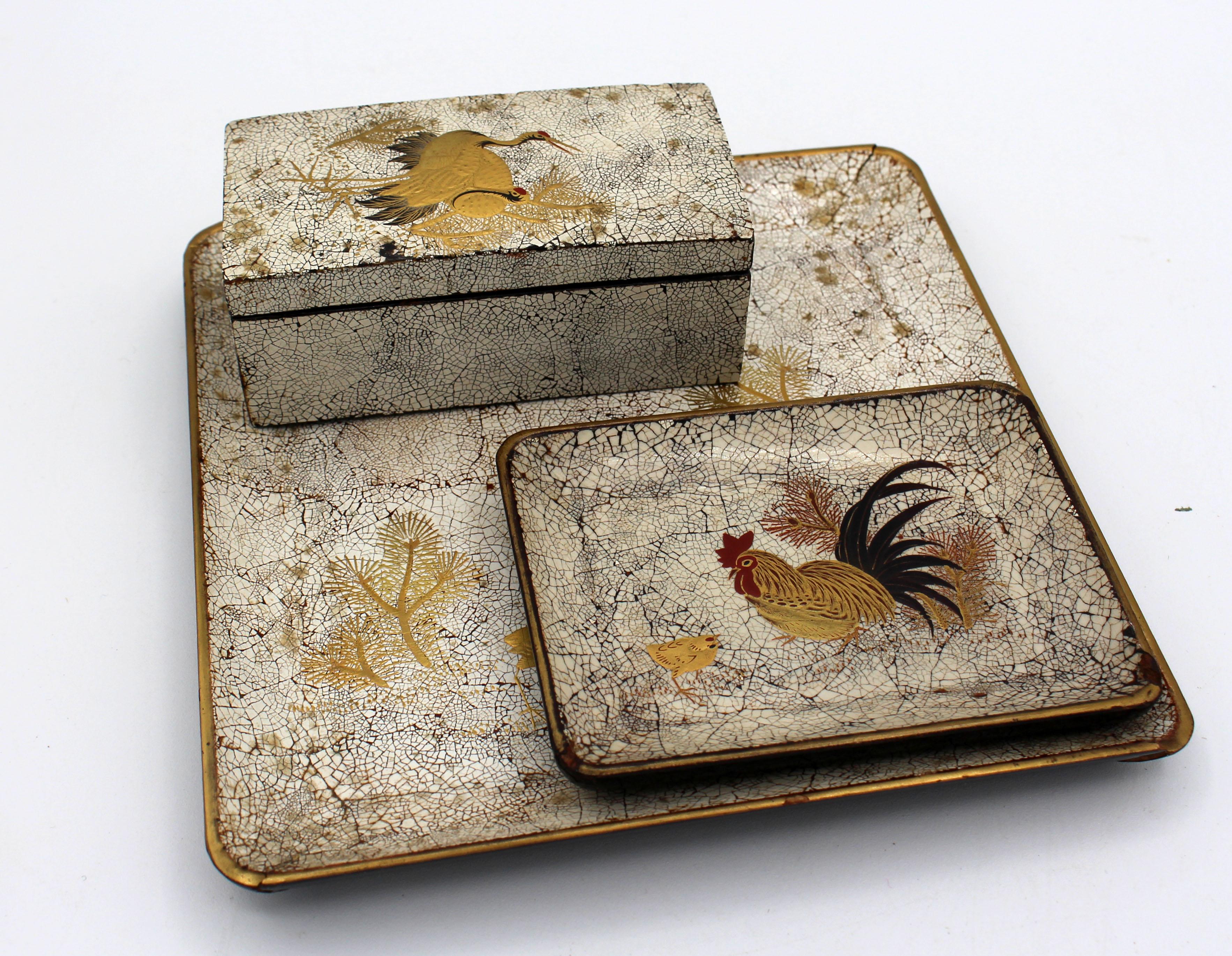 Circa 1900-1910 lacquer set comprised of a square tray, rectangular tray & rectangular box, Japan. Meiji period. Crackled eggshell lacquer, all decorated with gold & painted birds (cranes & a rooster with chick). Large tray with edge split &