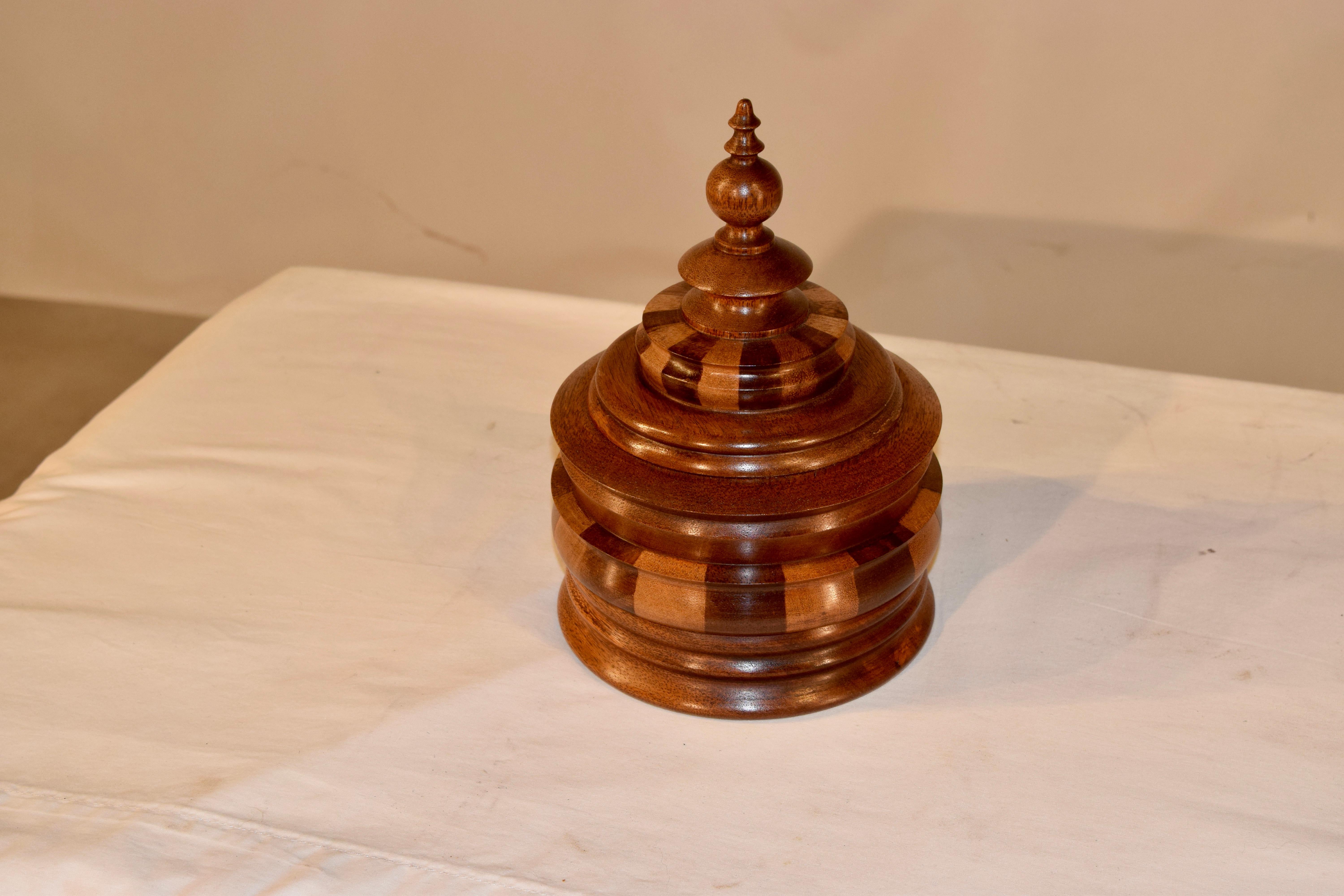 C. 1900 very large oak and fruitwood turned jar with a tall hand turned finial atop a hand turned and striped detailed lid over a hand turned base, which also has striped and turned wood detailing. Lovely shape and size.