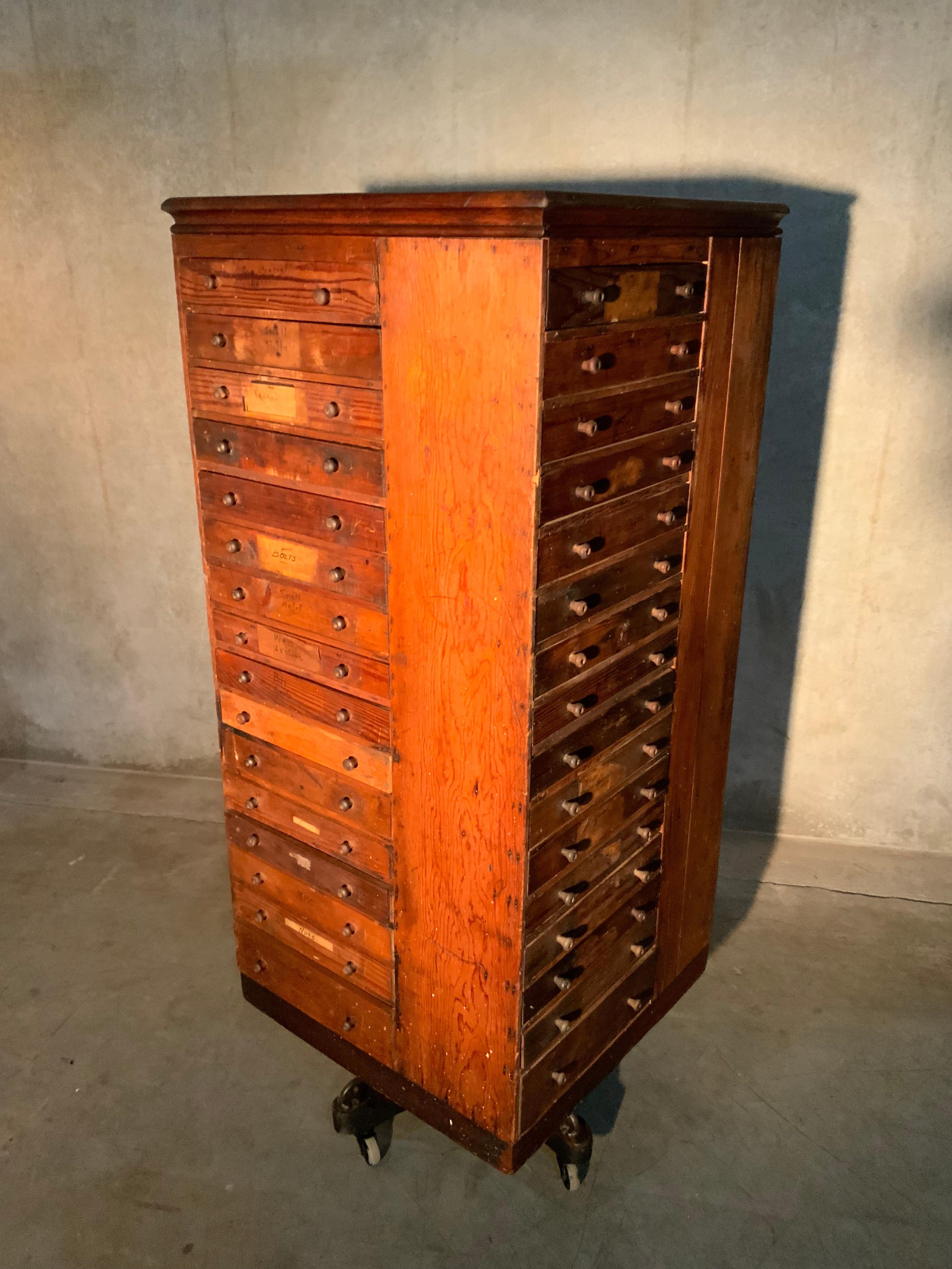 Found in Kentucky this early 20th c bolt bin has multiple original drawers with various tags along with a cast iron base and full functionality.
The patina is fabulous and configuration is perfect.