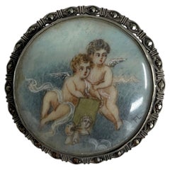 c. 1900s French Belle Époque Sterling Silver Marcasite Cherub Painting Brooch