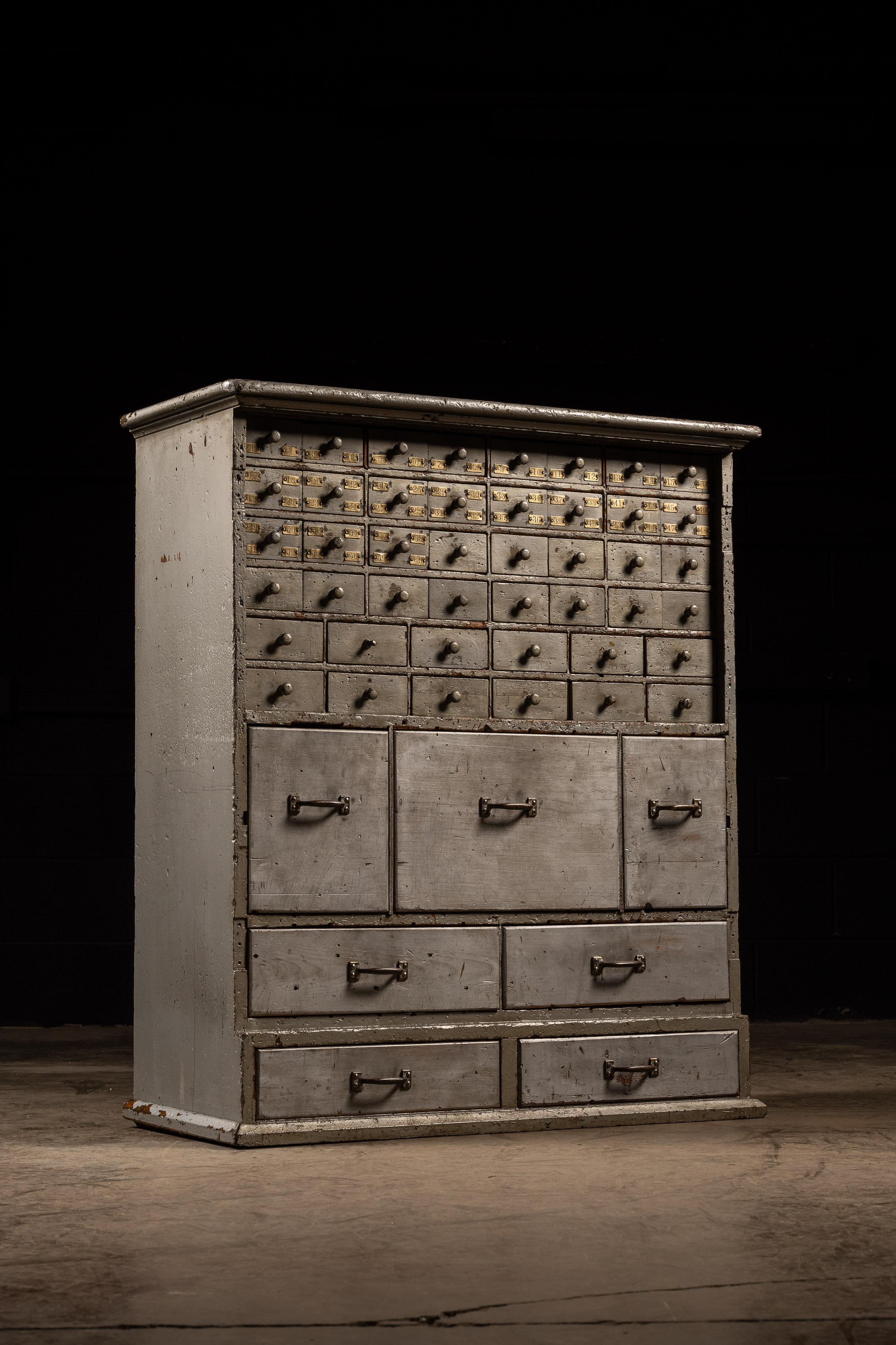 Early 20th Century c. 1920 Multi-Drawer Industrial Hardware Cabinet in Gray For Sale