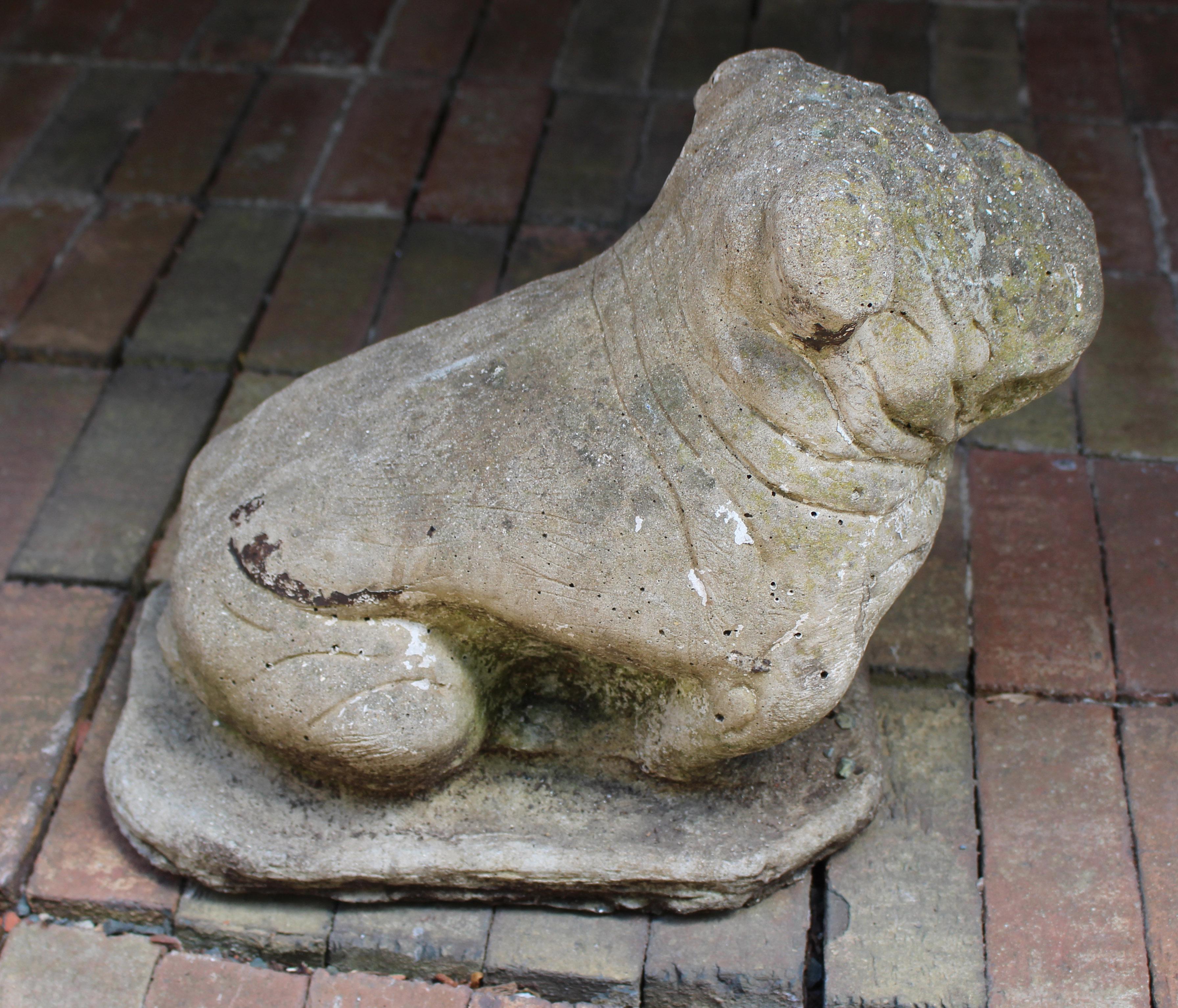 Circa 1920s cast stone Bulldog garden ornament, English. Wonderful face cascading with wrinkles. Great weathered surfaces.
14