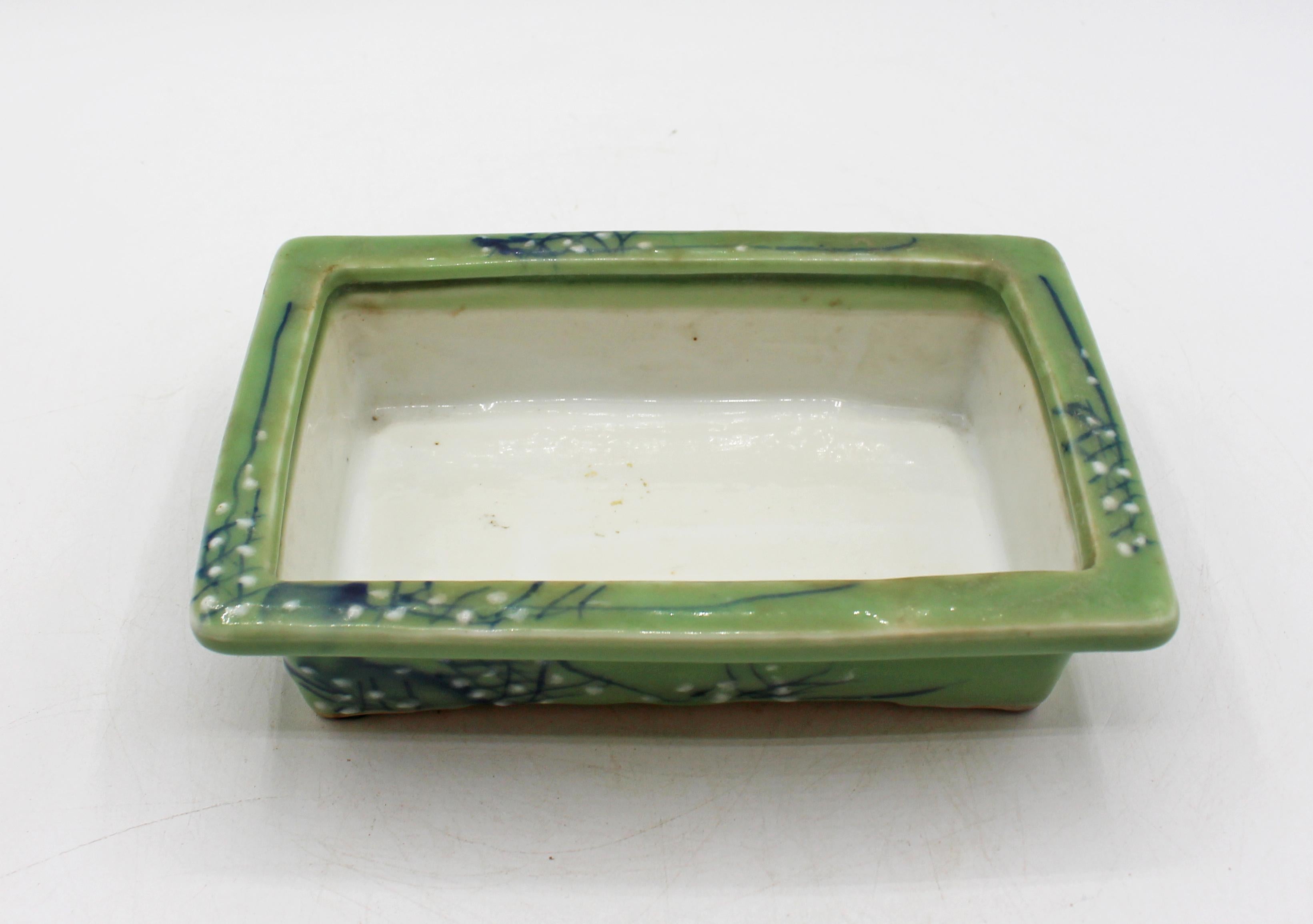 Circa 1930 Japanese porcelain celadon bonsai pot. Blue underglaze branches & white pâte-sur-pâte blossoms. Also used for Ikebana. Marked 