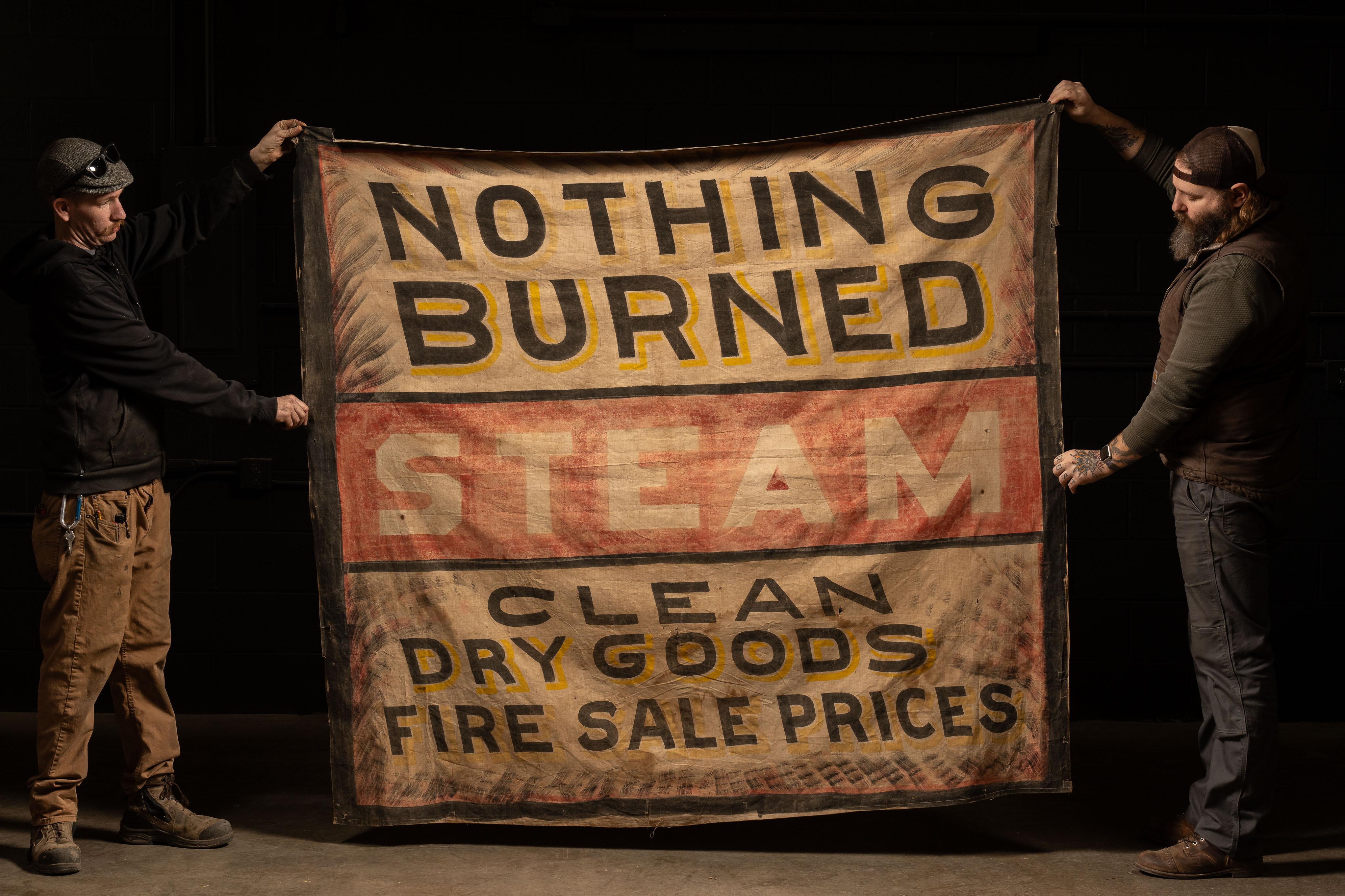 c. 1930 linen banner (likely cotton) advertising a dry/steam cleaner business. There are no identifiers as to which business, so this was likely placed on the storefront to draw in business. Due to there being no identifiers, its difficult to