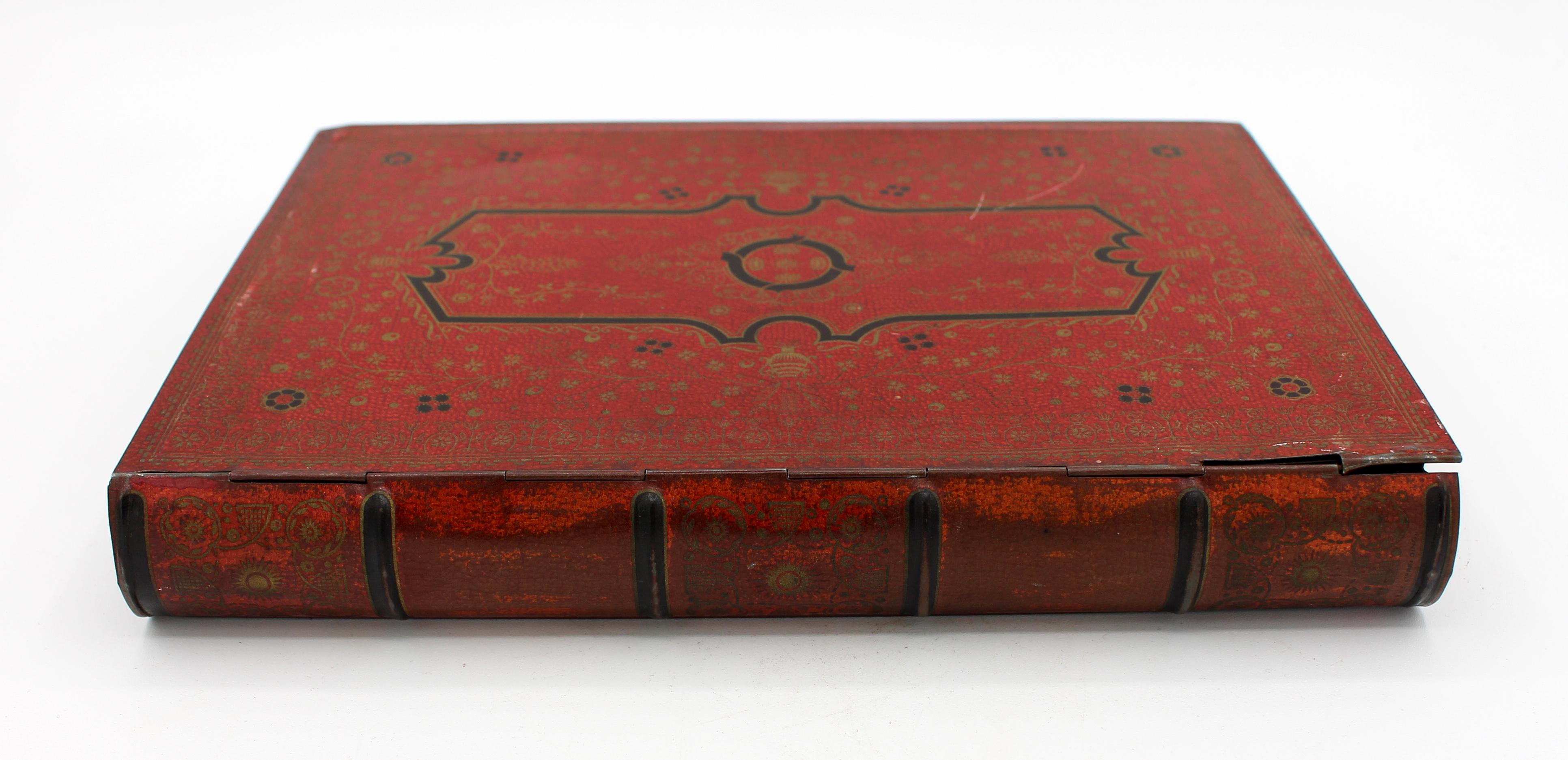 Large scarlet book form biscuit tin box by Huntley & Palmers, c.1930s-40s, English. Scarlet with black & gilt cartouche & floral designs, with gilt 
