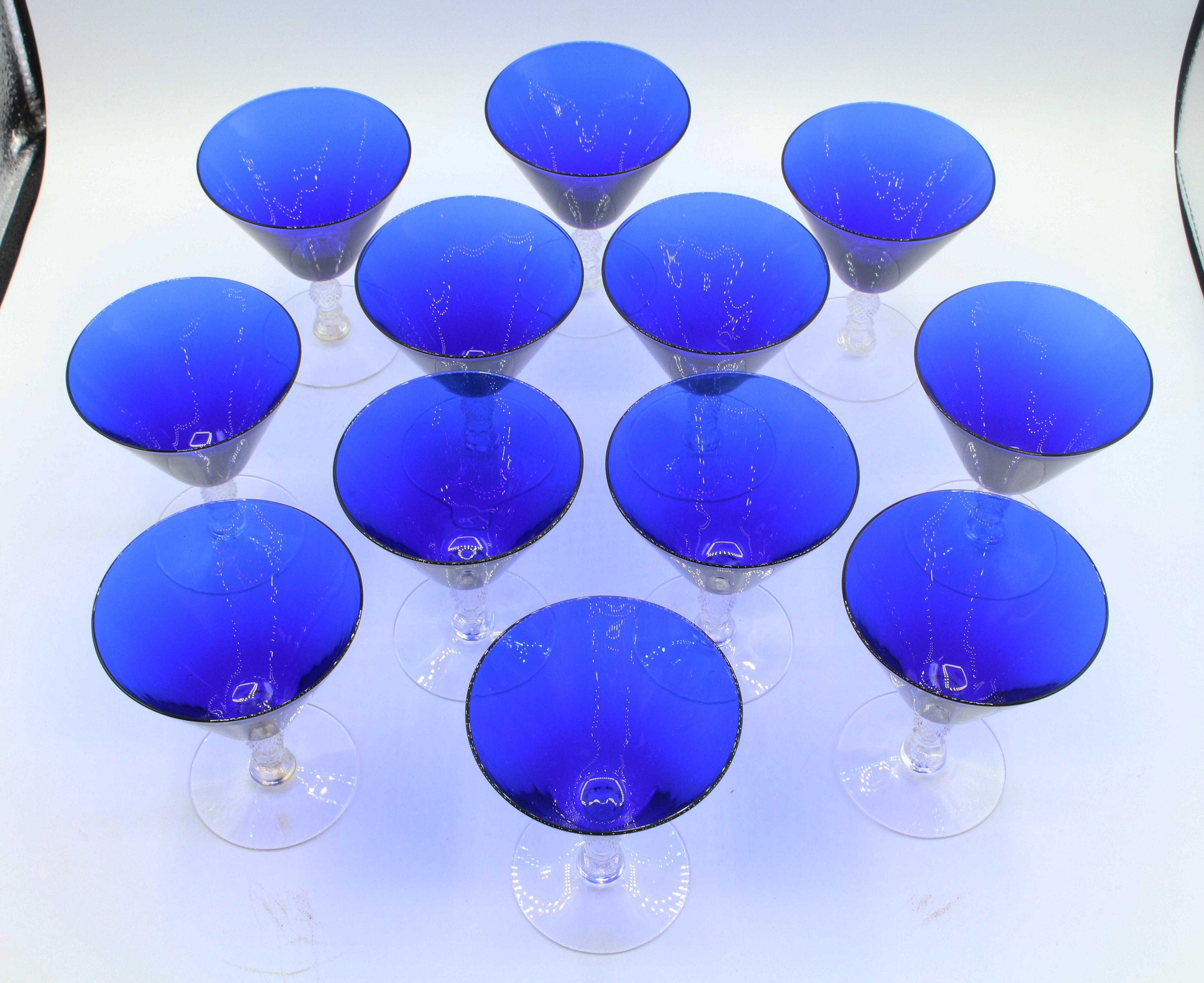 A set of 12 oyster glasses by Cambridge Glass Co., Ohio, c.1930s. Cobalt Blue bowls with faceted, molded clear glass stems & bases. Pattern 3122, rarely found. One with outer rim small rough spot.
4 5/8