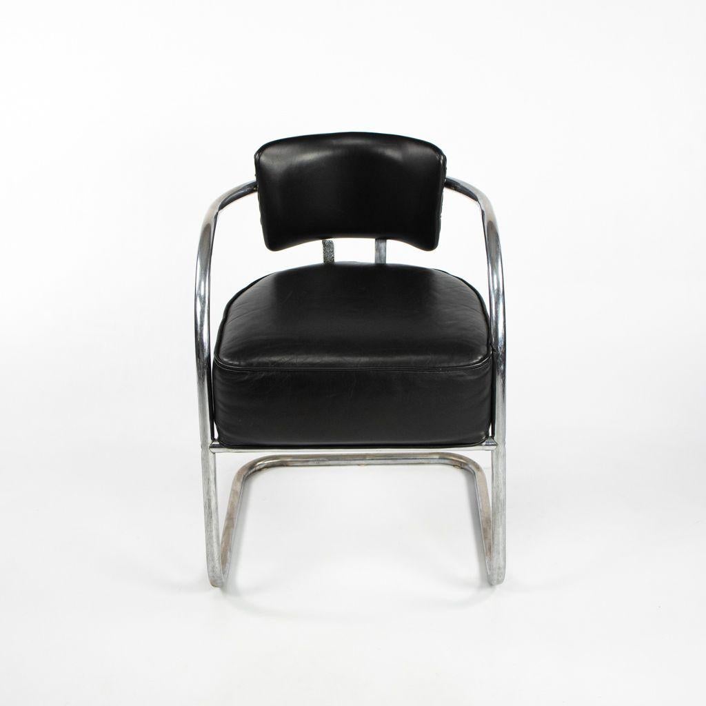 This is an Art Deco Cantilever Chair, attributed to Kem Weber for Lloyd's Manufacturing. The chair has a tubular polished stainless steel frame, and it retains its original black leather upholstery. 

This chair measures 22 inches deep, 20.5 inches
