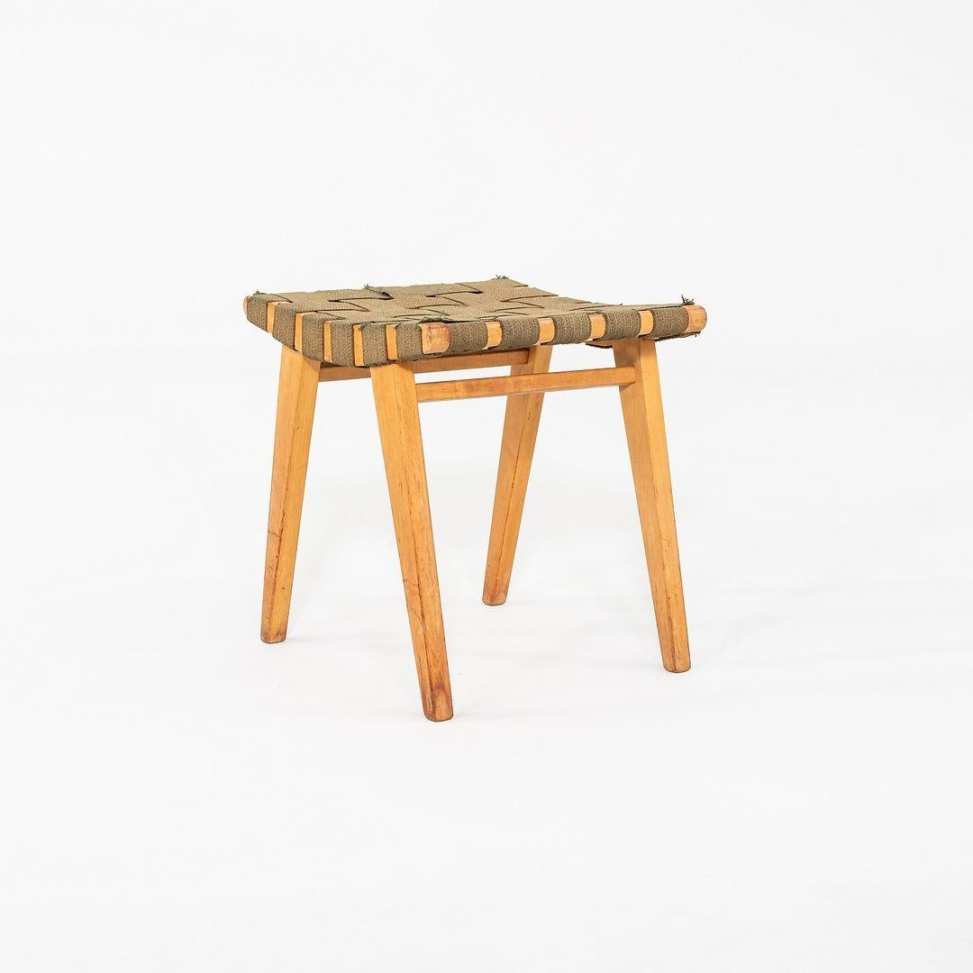 This is a Risom Stool, Model 667-W, originally designed by Jens Risom in 1946. This particular example was produced by Knoll in the USA C. 1946. The stools design is comprised of a maple frame and webbed fabric. 
 
 The stool measures 16.75 inches