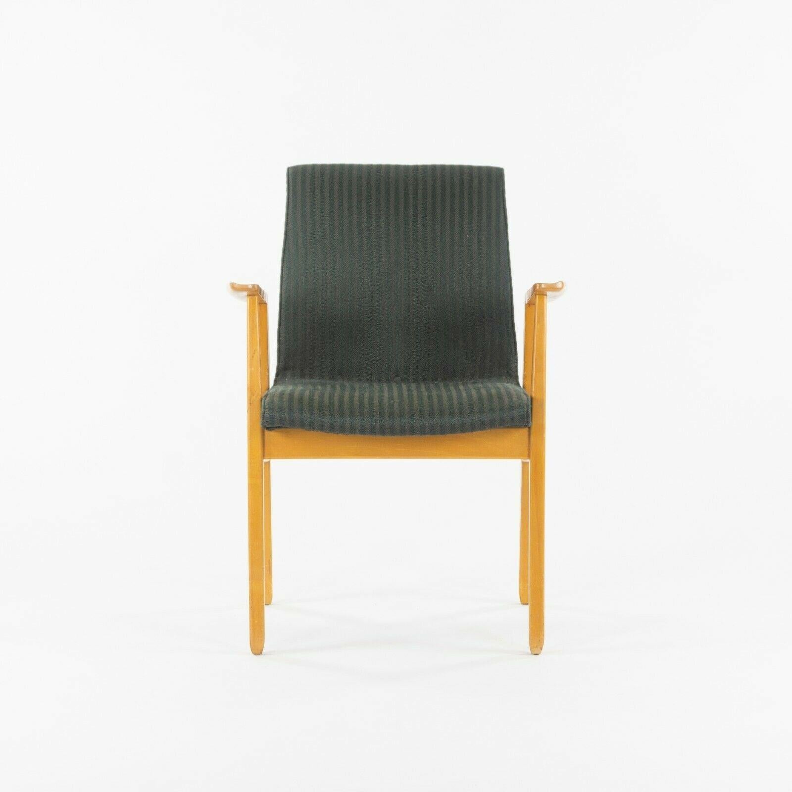 Listed for sale is an exceptional early Knoll Associates armchair, designed by Jens Risom. This example has what looks to be a natural maple frame and lovely striped black fabric. The chair notably retains its original Knoll Associates label, which