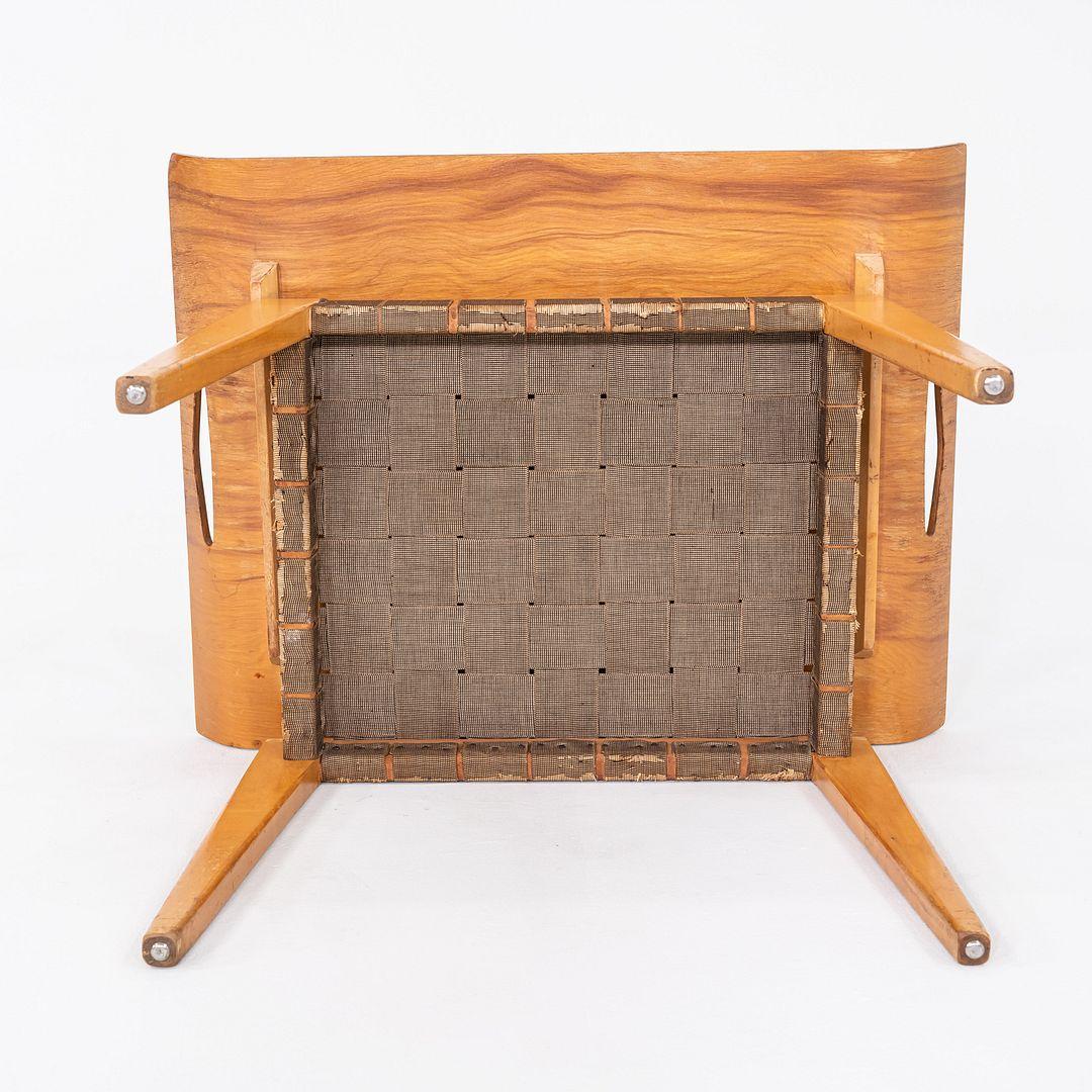 This is a Model 50 Single Tray Table, originally designed by Abel Sorensen in 1946. This particular example was produced by Knoll in 1947. The table's frame is comprised of maple and is upholstered with a maple webbing.
 

 The table measures 14.75