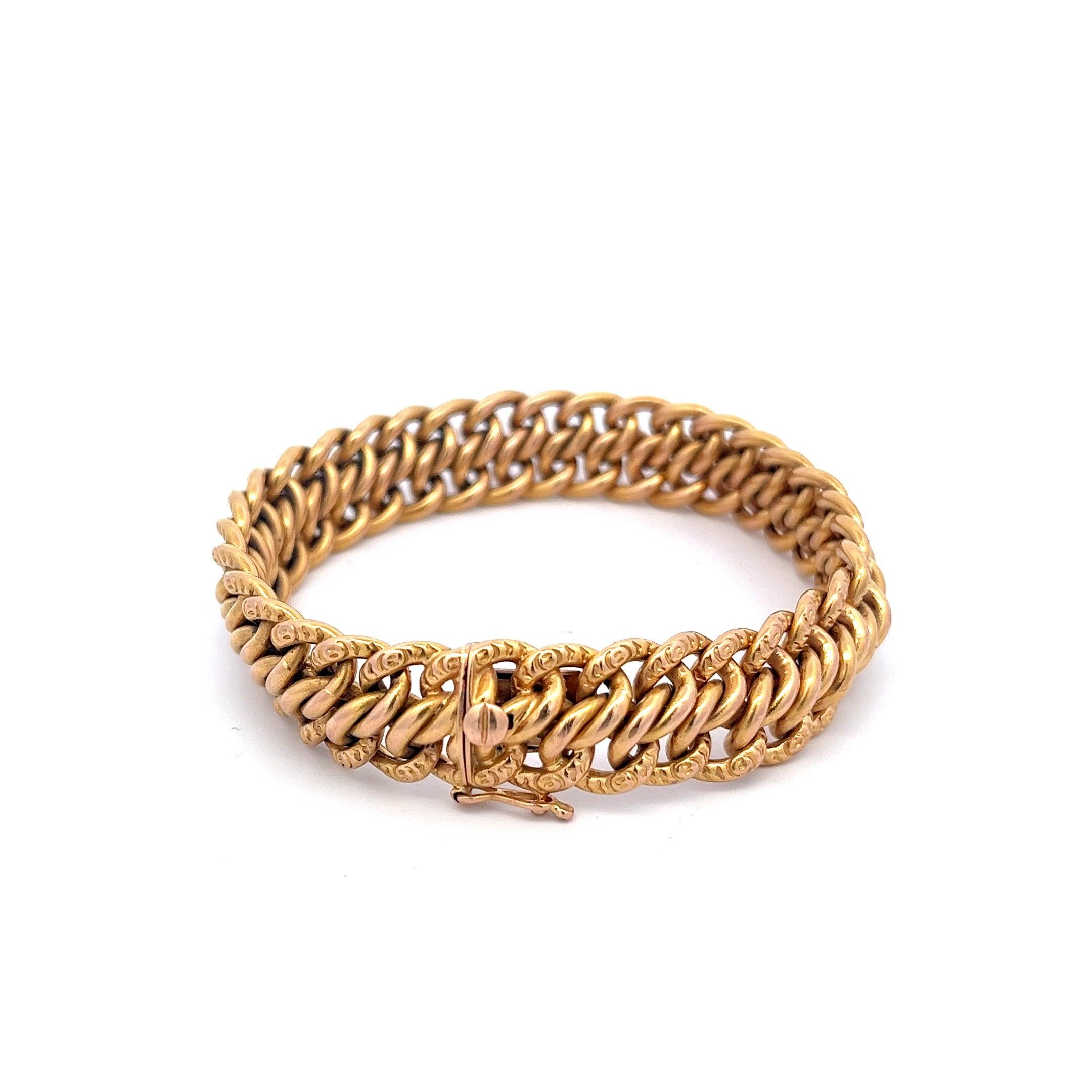 This exquisite bracelet showcases the artistry and craftsmanship of French jewelry-making. Designed with a timeless curb link motif, this bracelet features approximately 68 interlocking links, cleverly arranged to create the illusion of three rows