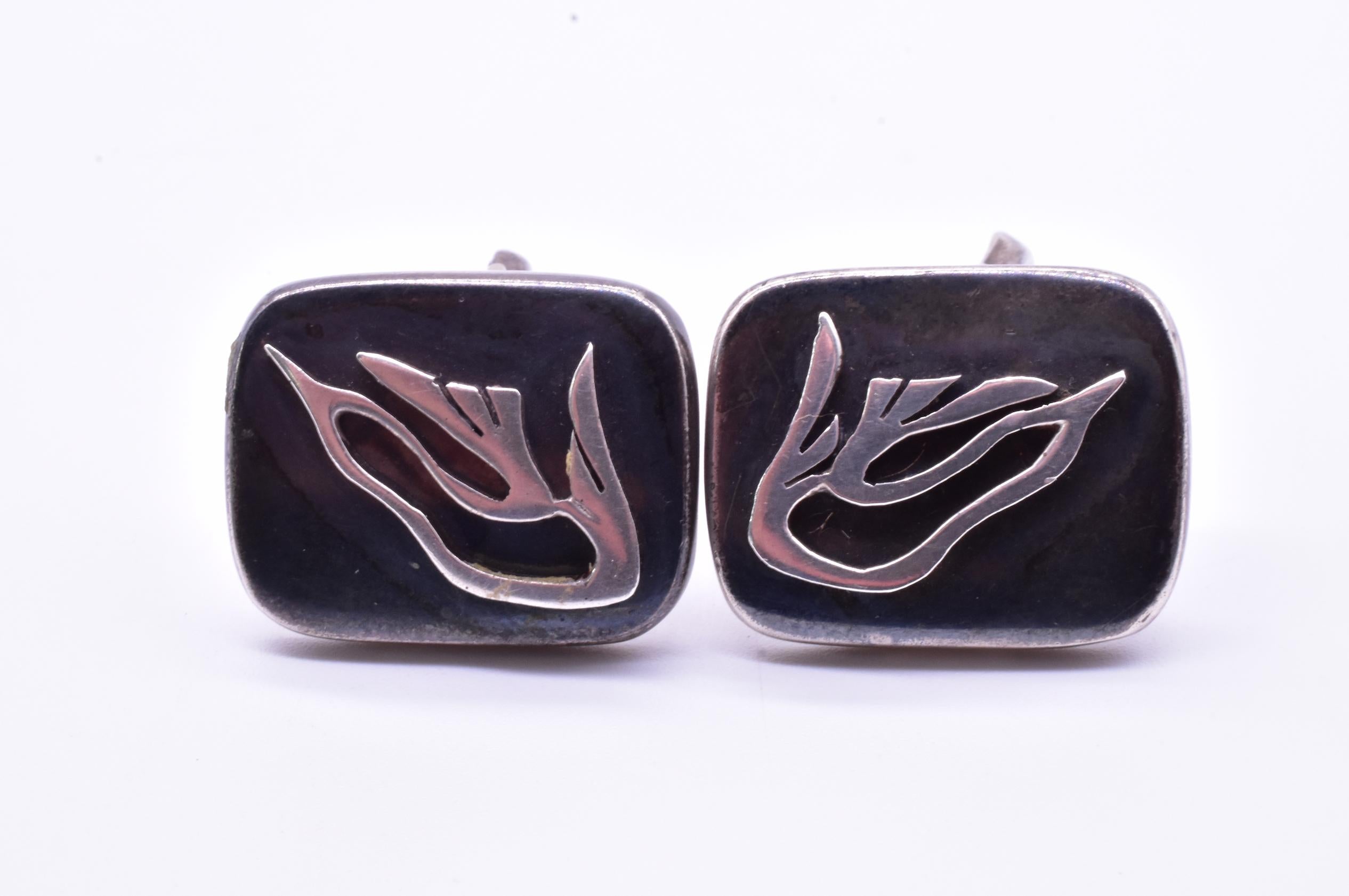 Enrique Ledesma was a silversmith who trained in the famous artist's colony in Taxco under William Spratling, the well known jewelry designer in the early 20th century. He opened his own workshop in 1950 and is known for his beautiful and blending