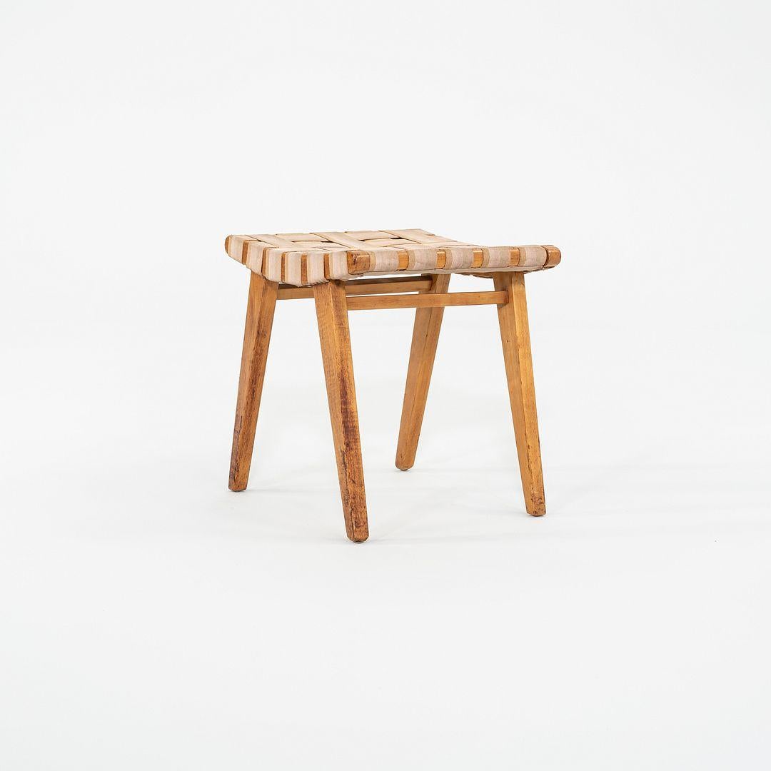 This is a Risom Stool, Model 667-W, originally designed by Jens Risom in 1946. This particular example was produced by Knoll in the USA C. 1951. The stools design is comprised of a maple frame and webbed fabric. 

The stool measures 16.75 inches