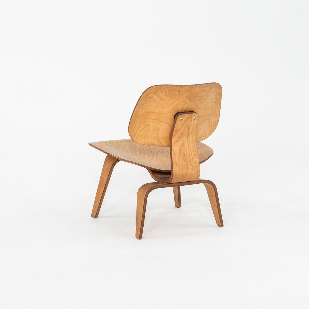 This is a pair of LCW Lounge Chairs, originally designed by Ray and Charles Eames in 1948. They are early Herman Miller examples and feature the 5-2-4 screw pattern, and these particular examples date back to the year 1951. The chairs are composed