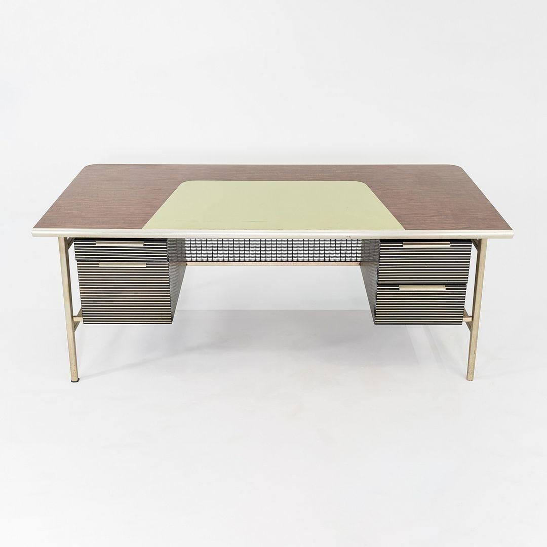 This is an Italic Desk, designed by Alcoa / Reynolds / GF Studios for Gordon Bunshaft and SOM's Reynolds Metals Headquarters in Richmond, VA. The design is largely seen as a collaboration, as SOM was hugely involved in furniture design at that time