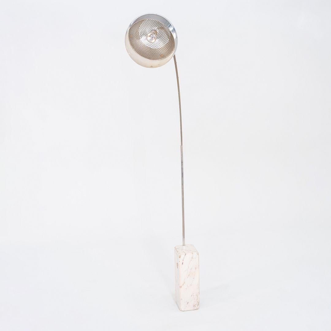 This is an 'Arco' Floor Lamp, designed by Achille and Pier Giacomo Castiglioni for Flos in Italy in 1962. This piece dates to the 1960s, as evidenced by its perforated diffuser with small holes. Later versions feature larger perforated holes. It has