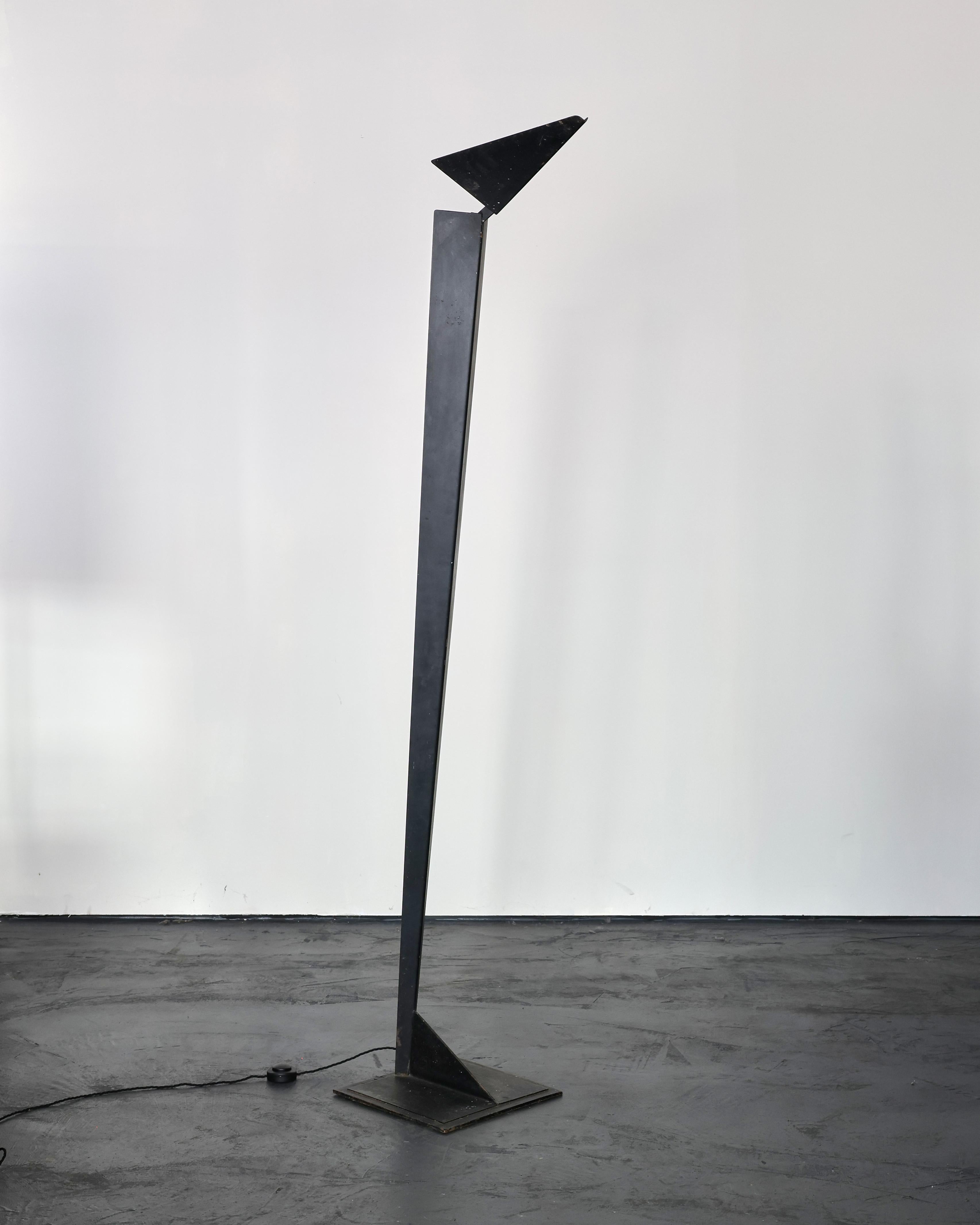A large 1960snorthern Italian steel standard lamp/up lighter.

Nicely patinated black painted finish.

Adjustable metal shade allows for changes in direction of light.

Recently re-wired.

Base measures 36cm x 36cm