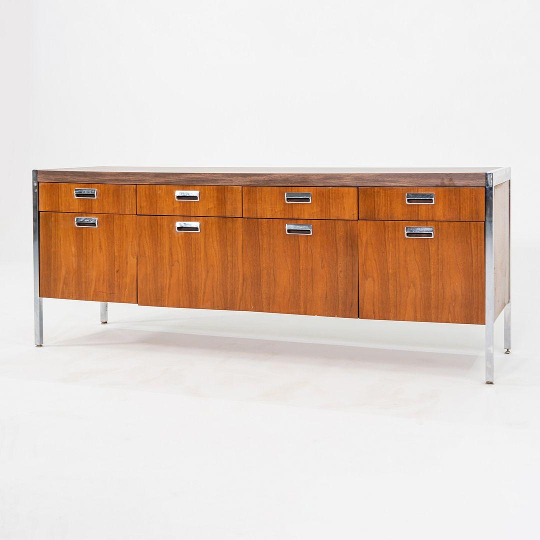 This is a substantial 900 Series Walnut and Chromed-Steel Credenza, model 9CR 75, designed in the late 1960s by Myrtle Desk of High Point, North Carolina. They referred to the piece as a 