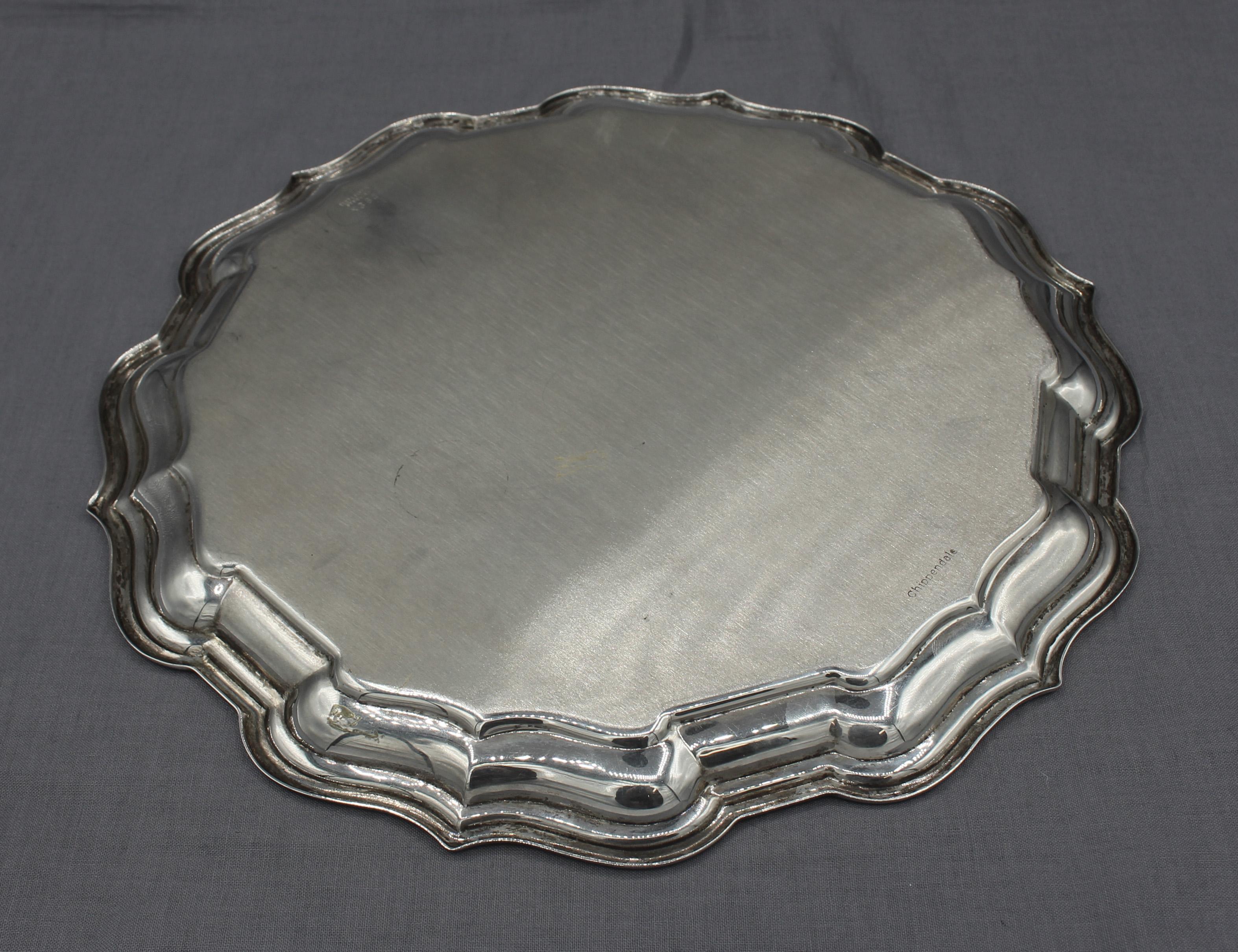 Sterling silver Chippendale pattern salver, c.1970, by Reed & Barton. Marked: Reed & Barton, Sterling, X364, Chippendale. Surface scratches commensurate with age & use. 11.95 troy oz.
10 1/8