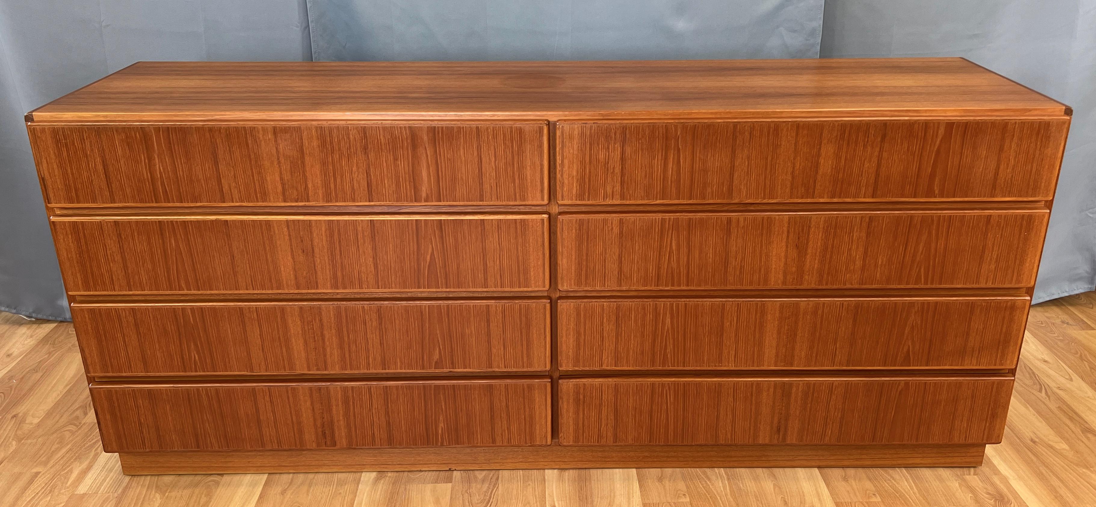 Offered here is a circa 1970s eight drawer Teak danish modern dresser by Komfort.
Has a nice simple clean design, with it's round edges, also finished on it's back side. 
With the eight drawers all the same size it will hold just about everything