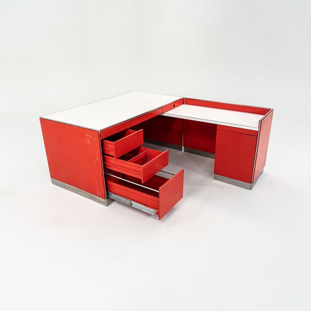 This is a large Split Reception Desk, initially designed by Davis Allen for General Fireproofing Reception circa 1974. This custom-designed piece truly exemplifies the cutting edge of office design at the time. It has a steel plinth base around its