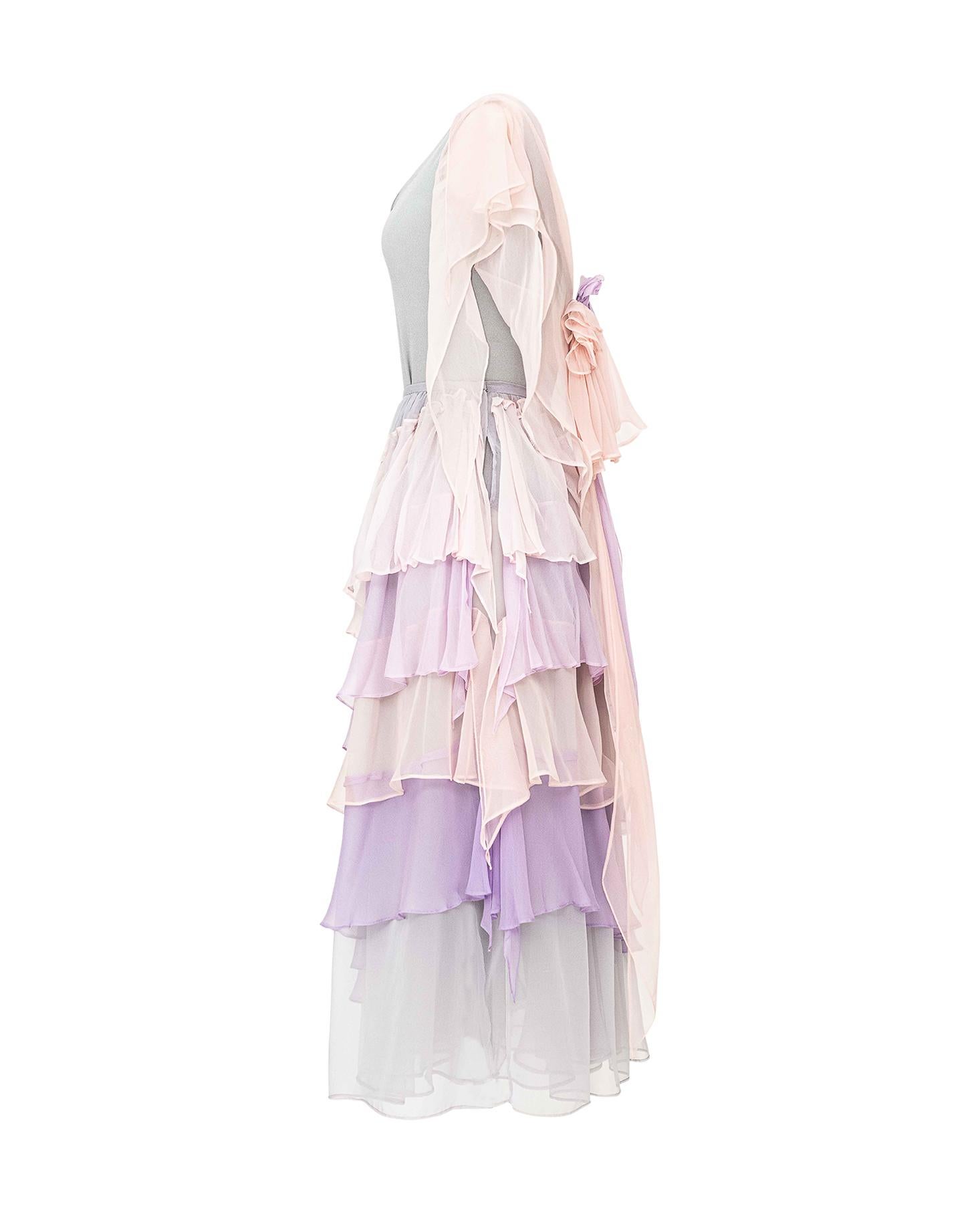 c. 1974 Giorgio Di Sant’Angelo “Romantic Chiffon Collection” slate grey bodysuit and tiered pastel silk chiffon skirt. Bodysuit is elastic with moderate stretch. Skirt is pink, purple and grey ruffle tiered design with great movement. Similar
