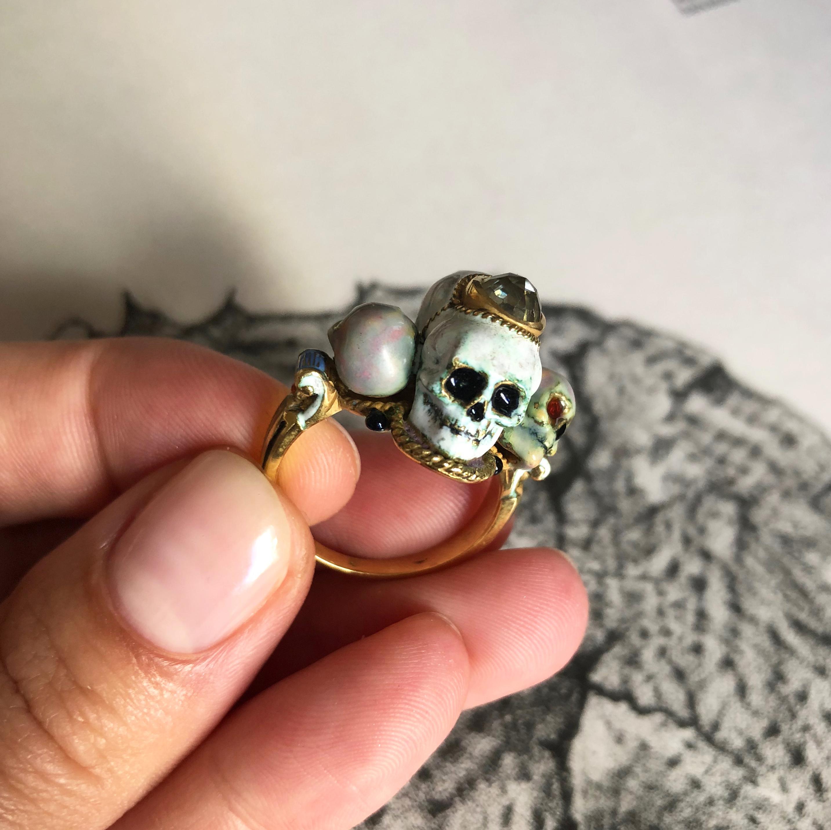 A vintage, diamond, enamel, and 18-karat gold four-headed skull ring by Attilio Codognato, Italy. Stamped A. Codognato Venezia. Size nine and perfect for a middle finger. The ring is an excellent and wearable example of Codognato's workmanship and