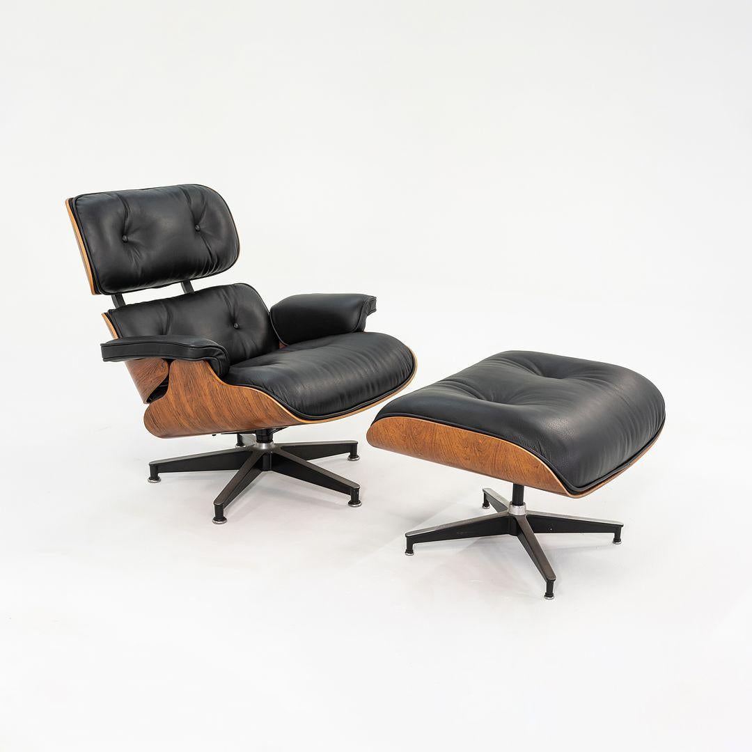 This is an original Eames Lounge Chair and Ottoman, models 670 and 671, designed by Charles and Ray Eames in 1956. This set dates to circa 1990 and has Brazilian rosewood shells. The cushions were newly redone by a master upholstery shop known for