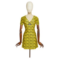 C. 1995 Dolce & Gabbana D&G Yellow Micro Mini Dress with Repeat Logos