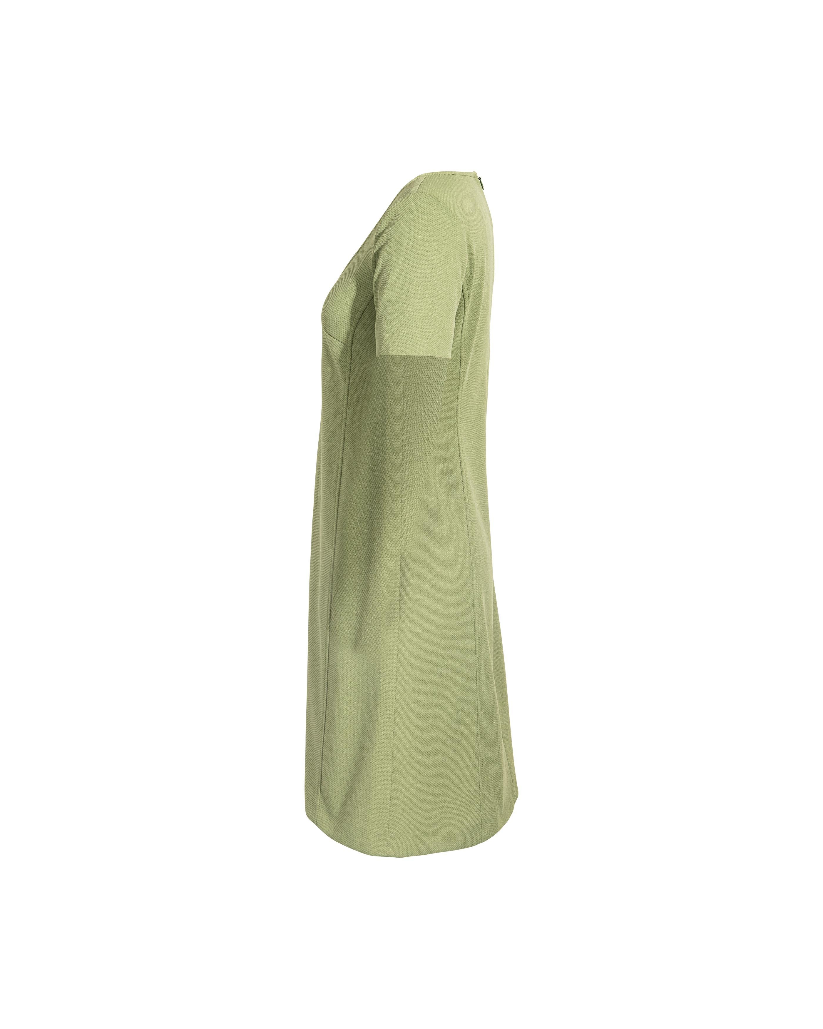 c. 1996 Miu Miu by Miuccia Prada green mini dress. Short sleeve scoop neck mini shift dress with A-line skirt and back zip closure. 100% Polyester. Same colorway featured on 1996 runway.