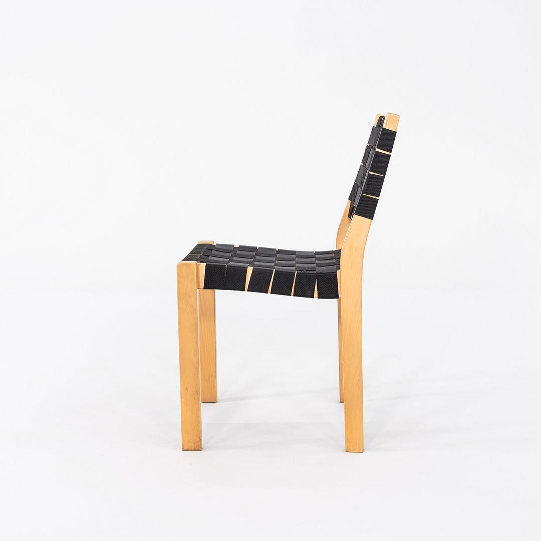 This is a set of four 611 Stacking Chairs, originally designed by Aino and Alvar Aalto in 1929. These particular examples were produced by Artek in Finland in the 2000s. Their frames are made from birch, which is then lacquered, and the chairs are